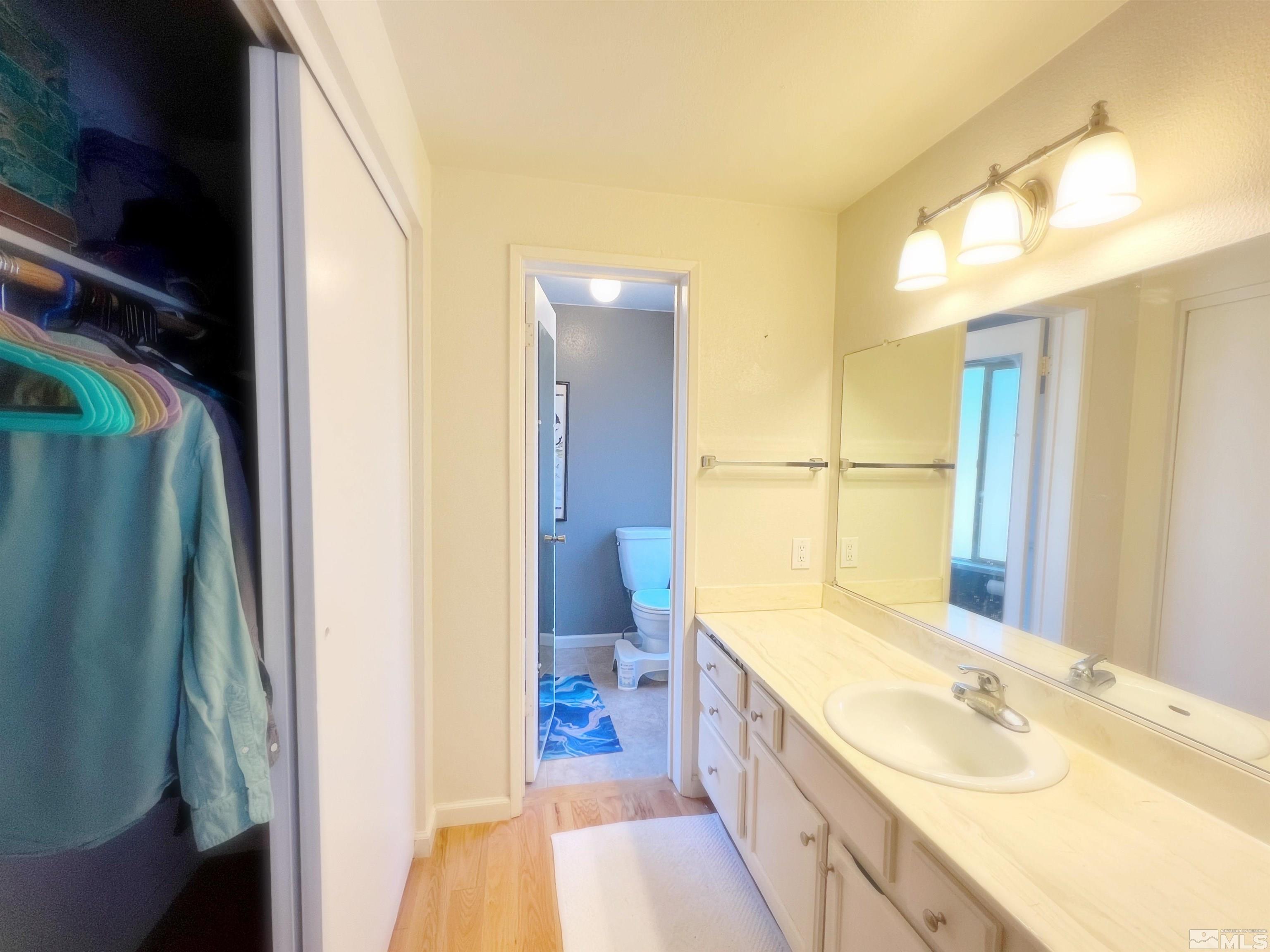 3849 Bexley Square Reno, NV 89503 - Photo 20 of 37 a spacious bathroom with a granite countertop double vanity sink a mirror and a shower