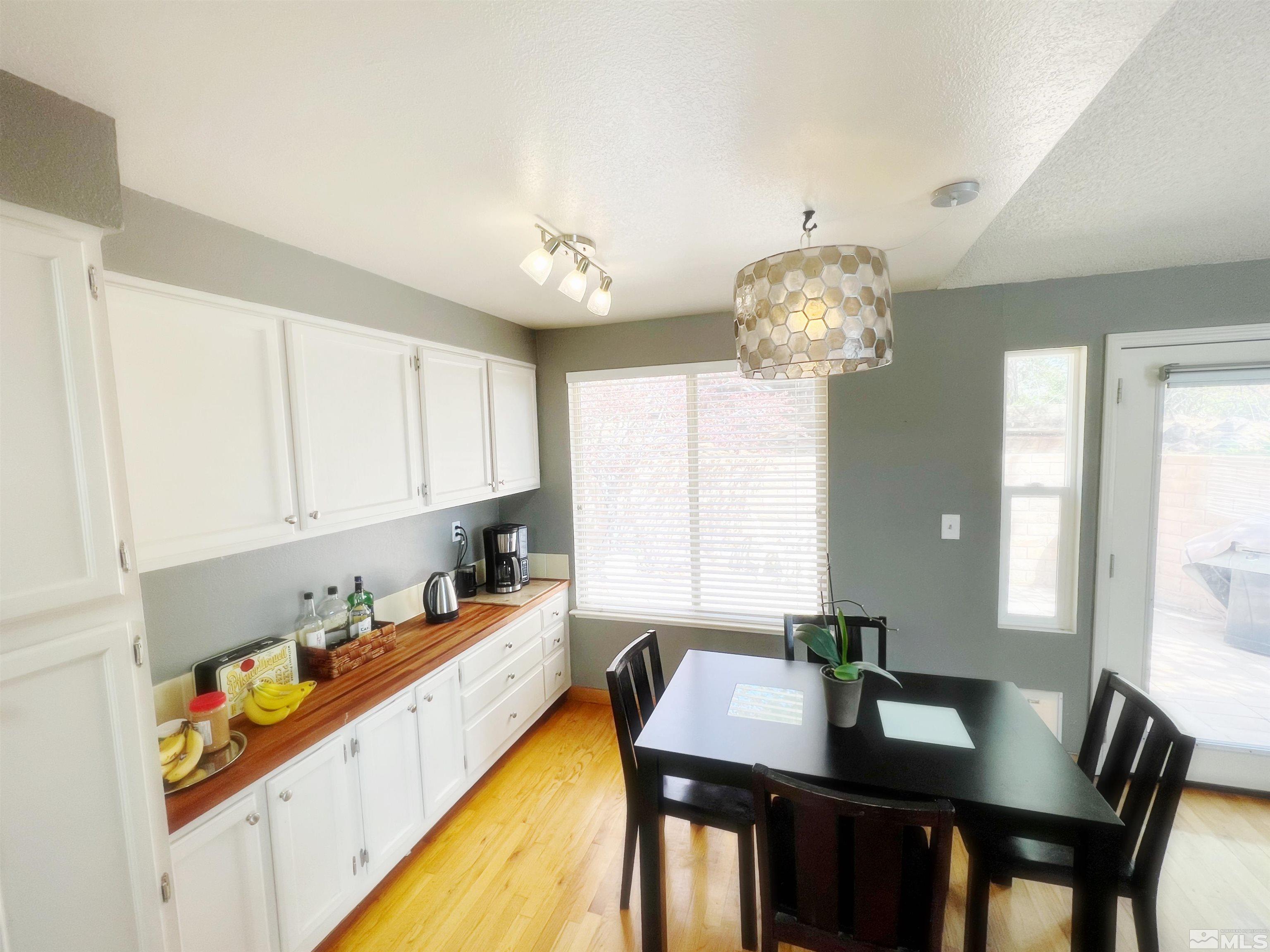 3849 Bexley Square Reno, NV 89503 - Photo 26 of 37 a kitchen with a table and chairs in it