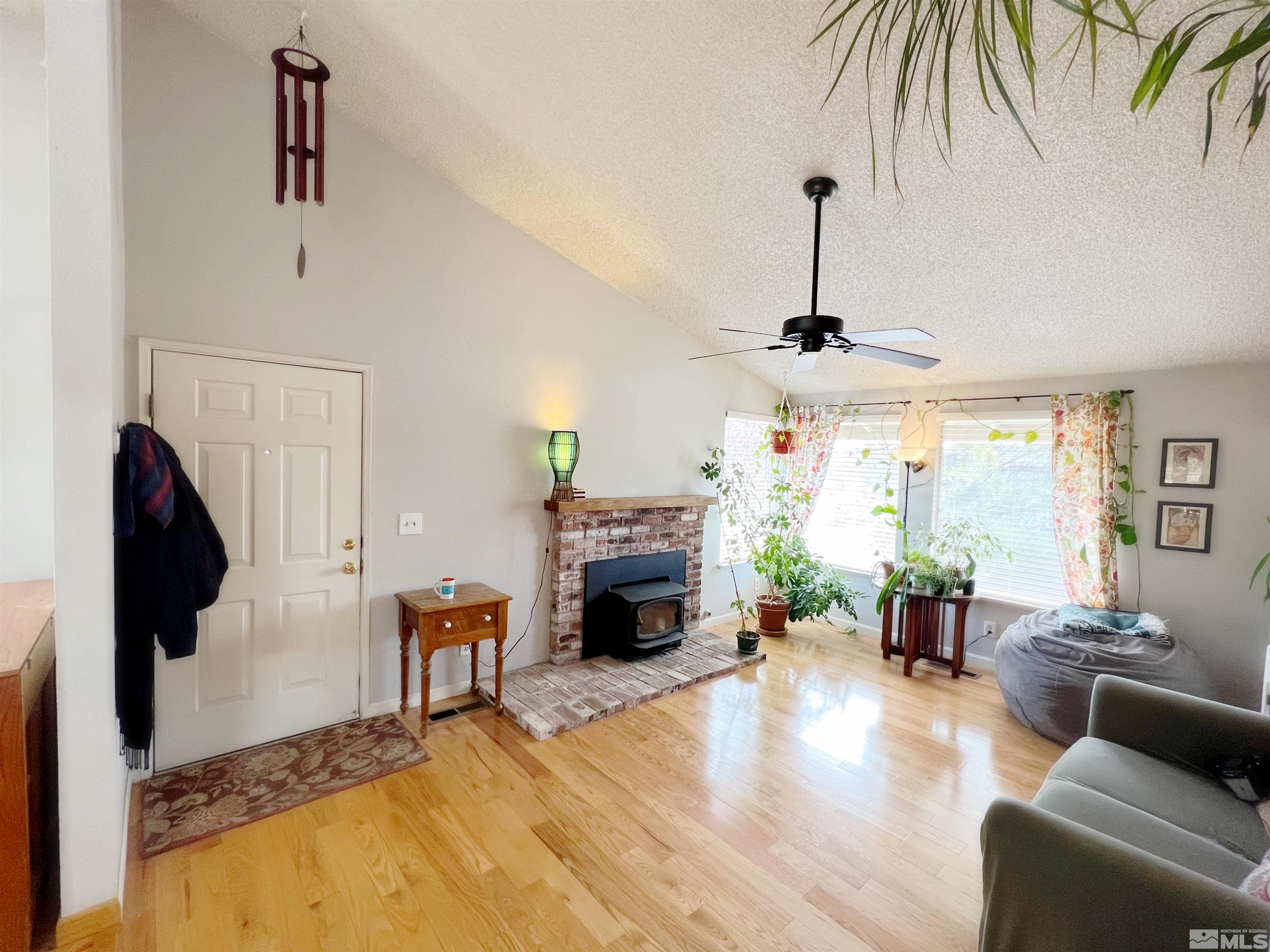 3849 Bexley Square Reno, NV 89503 - Photo 36 of 37 a living room with furniture and a fireplace