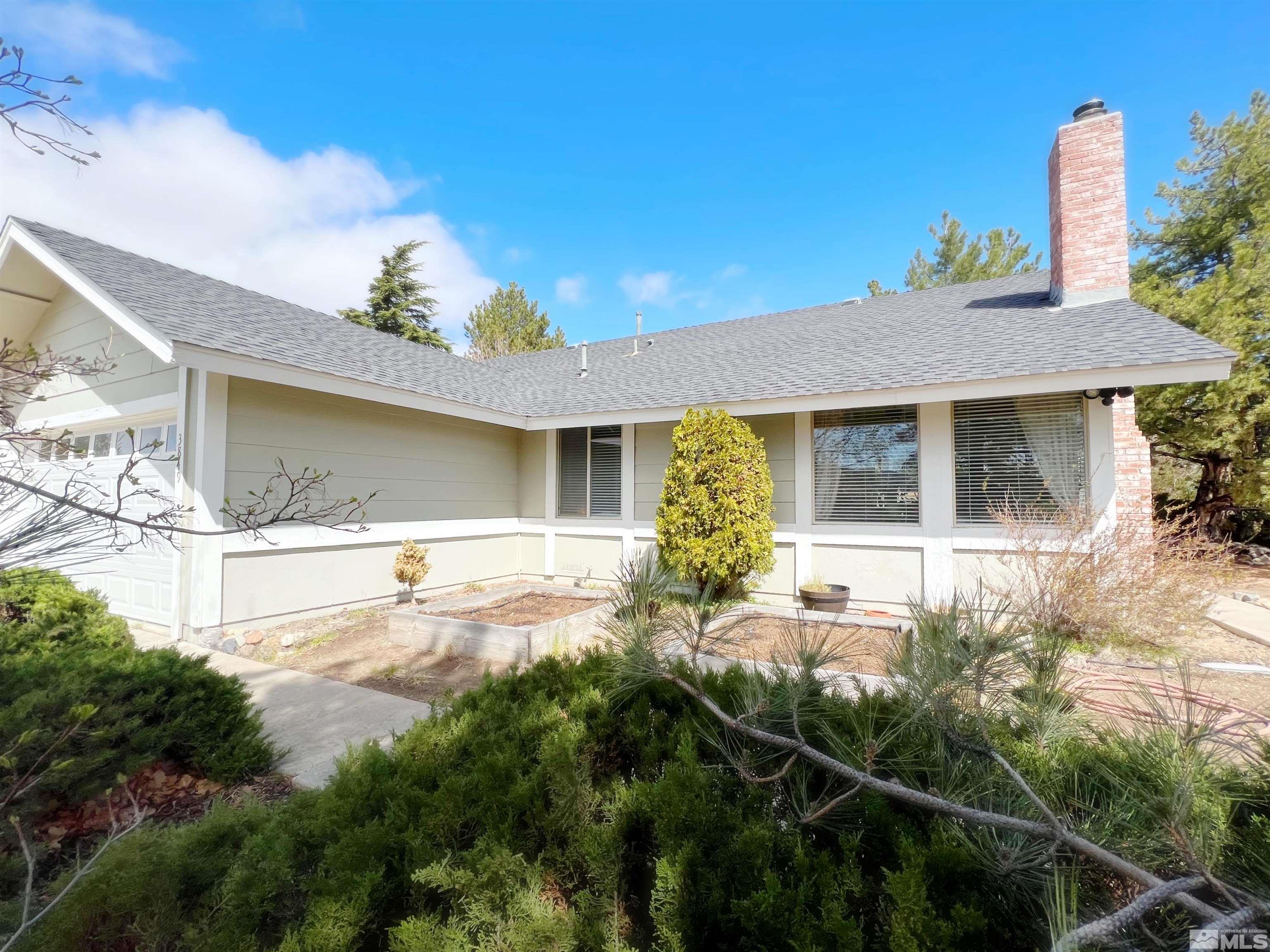 3849 Bexley Square Reno, NV 89503 - Photo 5 of 37 a front view of a house with garden