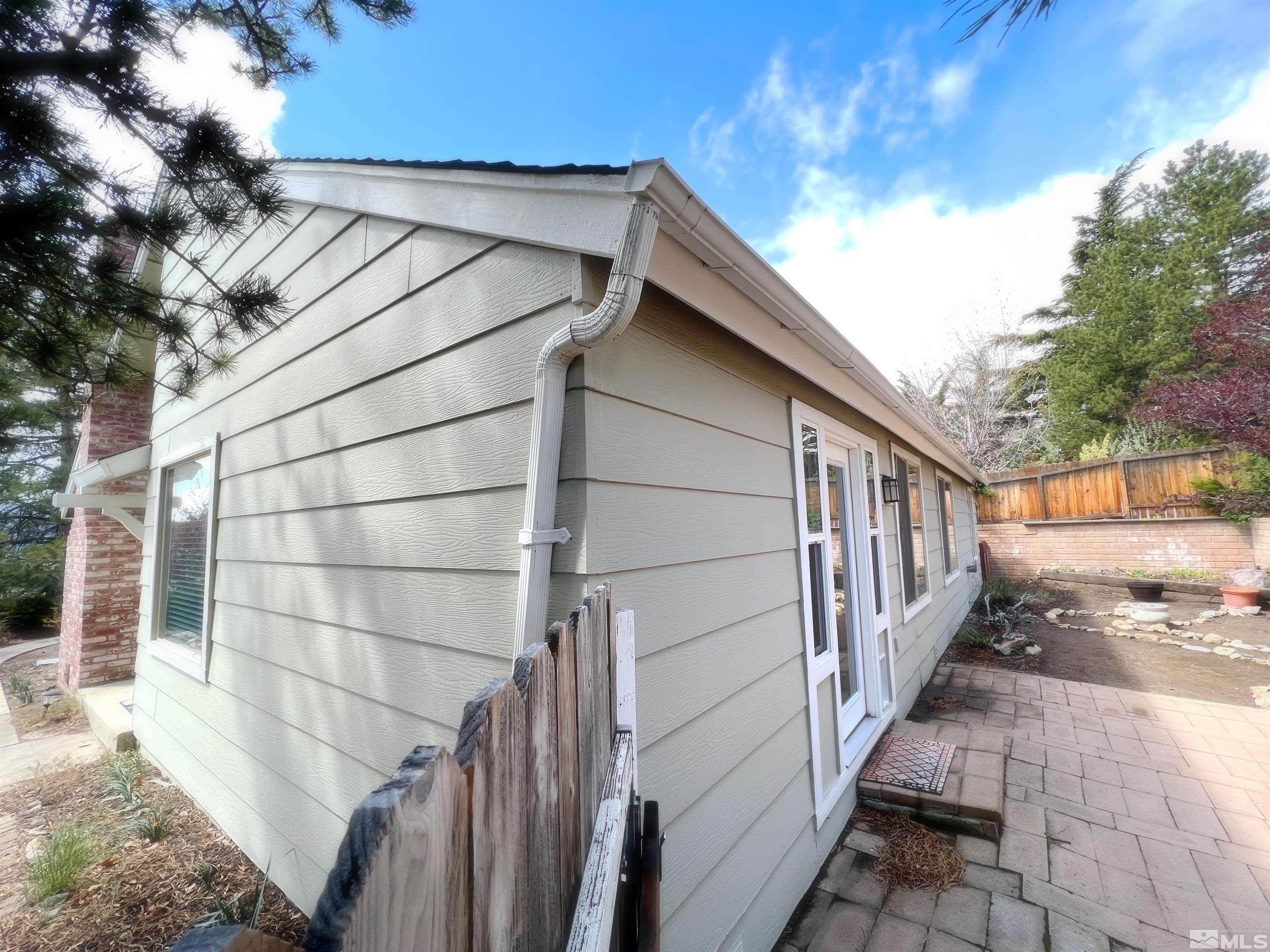 3849 Bexley Square Reno, NV 89503 - Photo 8 of 37 a view of a small yard with wooden floor and fence