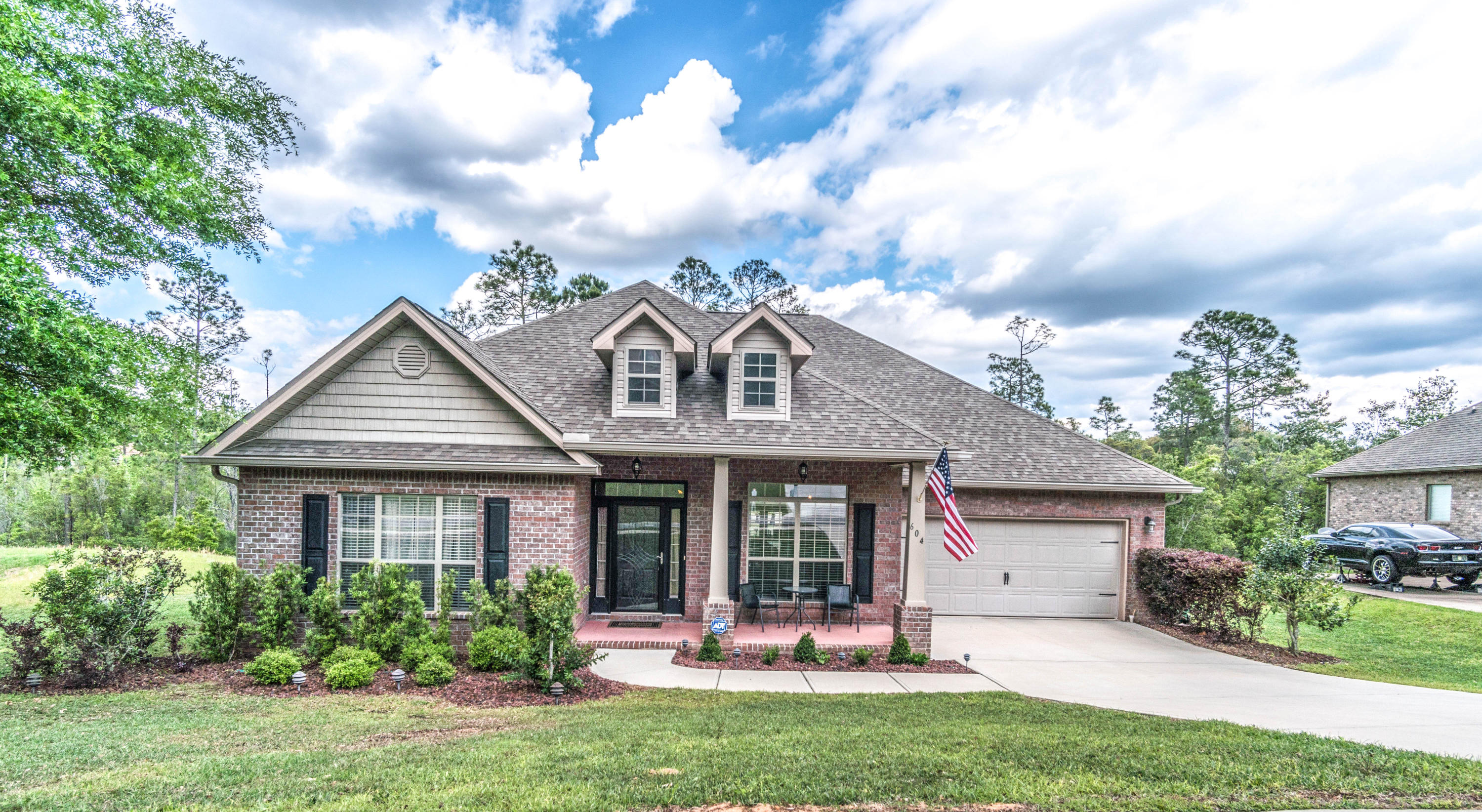 604 Red Fern Road Crestview, FL 32536 - Photo 1 of 36 a front view of a house with garden