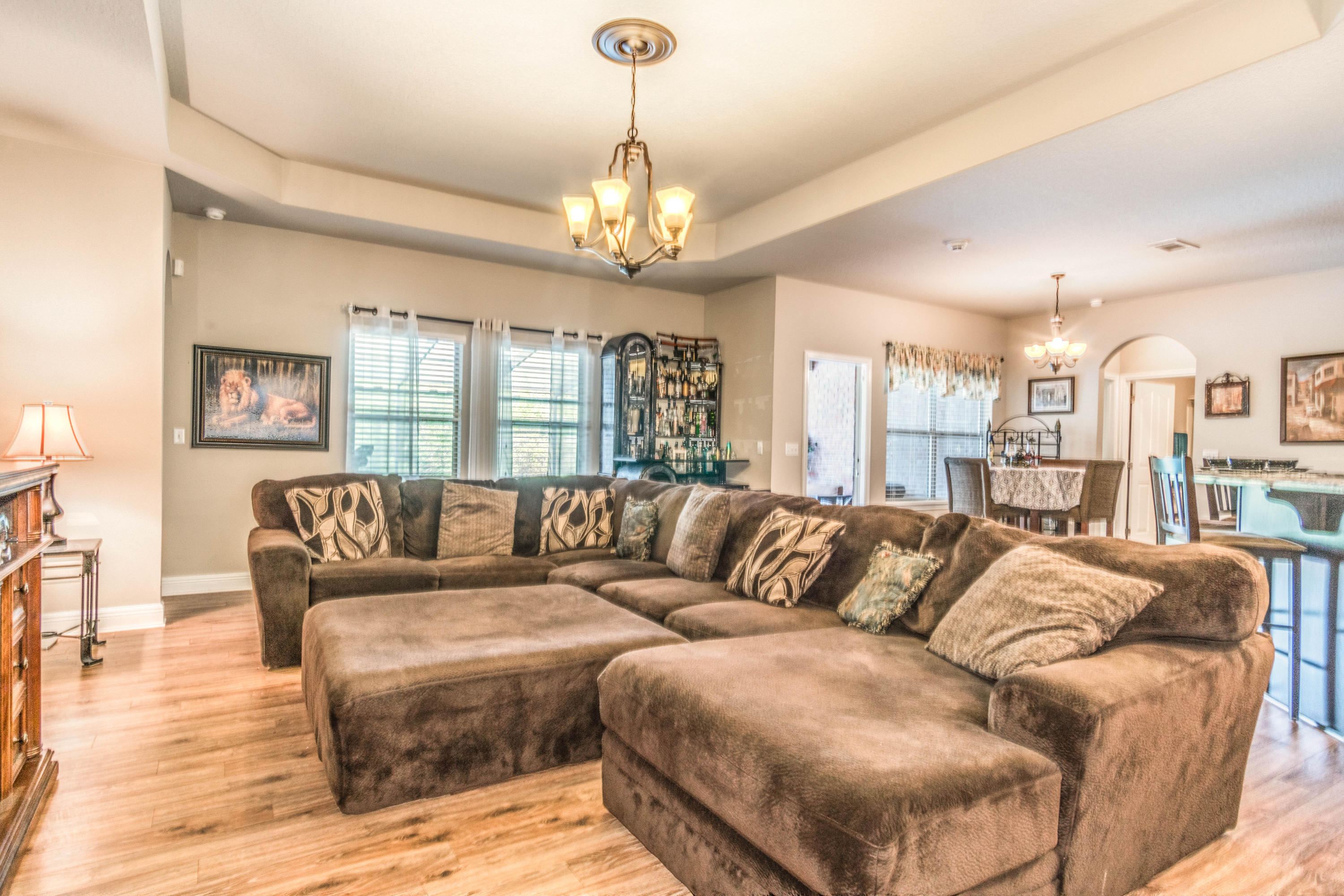 604 Red Fern Road Crestview, FL 32536 - Photo 13 of 36 a living room with furniture and a chandelier