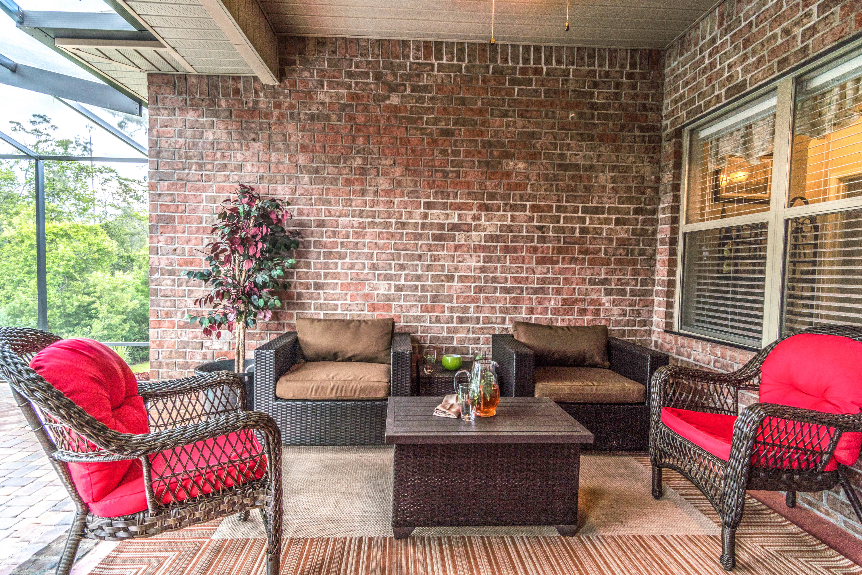 604 Red Fern Road Crestview, FL 32536 - Photo 15 of 36 a view of a patio with couches chairs and a potted plant