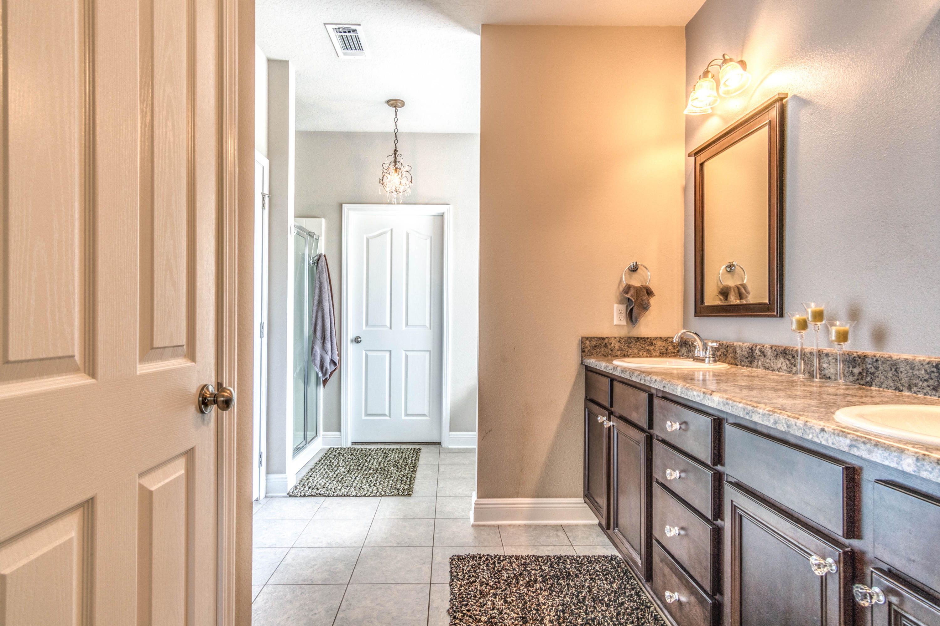 604 Red Fern Road Crestview, FL 32536 - Photo 23 of 36 a bathroom with a granite countertop sink and a mirror