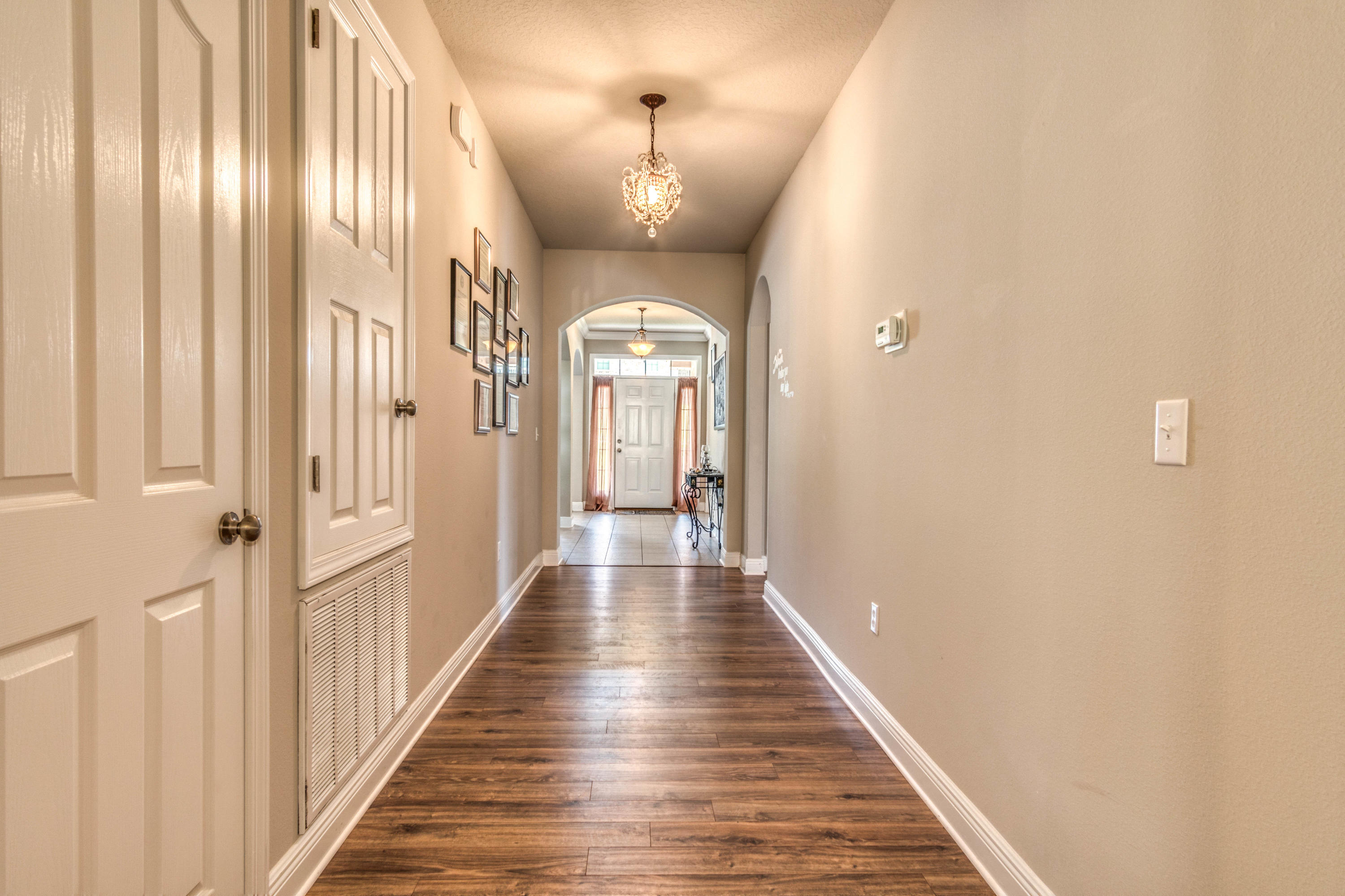 604 Red Fern Road Crestview, FL 32536 - Photo 26 of 36 a view of a hallway with wooden floor