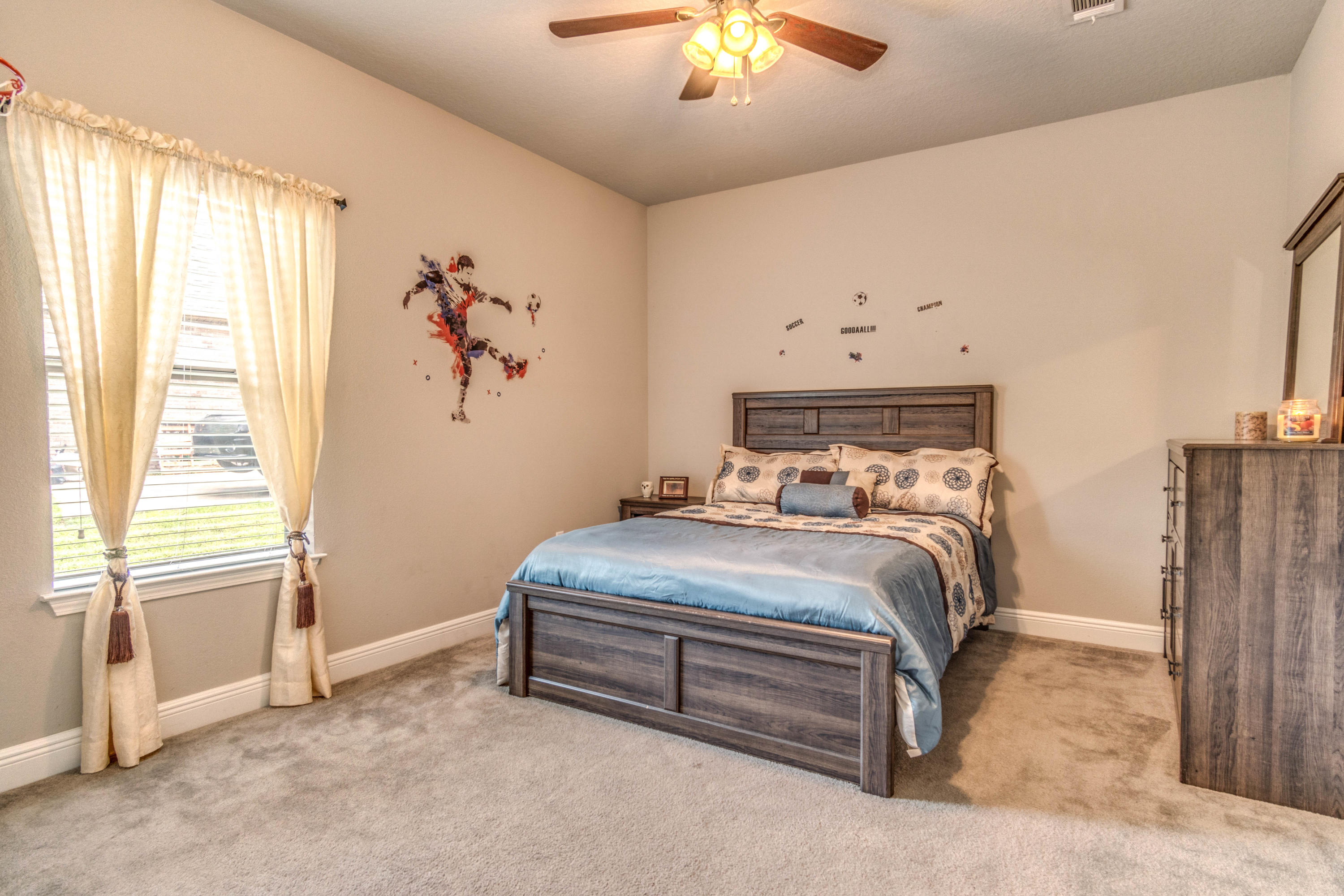 604 Red Fern Road Crestview, FL 32536 - Photo 31 of 36 a bedroom with a bed and a chandelier