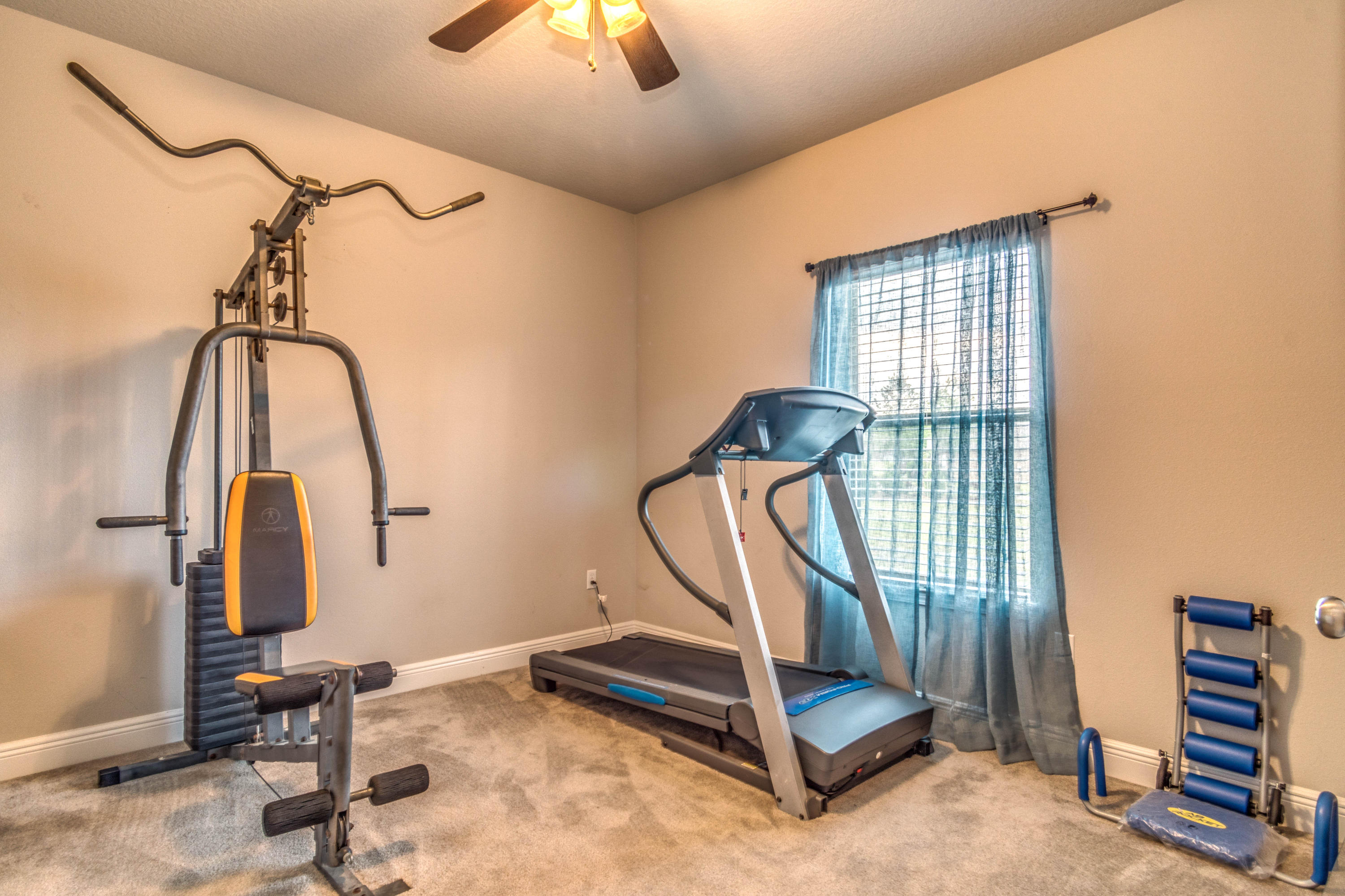 604 Red Fern Road Crestview, FL 32536 - Photo 33 of 36 a view of a room with gym equipment