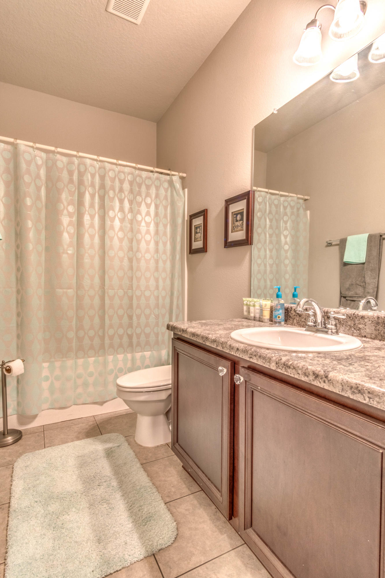 604 Red Fern Road Crestview, FL 32536 - Photo 35 of 36 a bathroom with a granite countertop sink a toilet and a bathtub