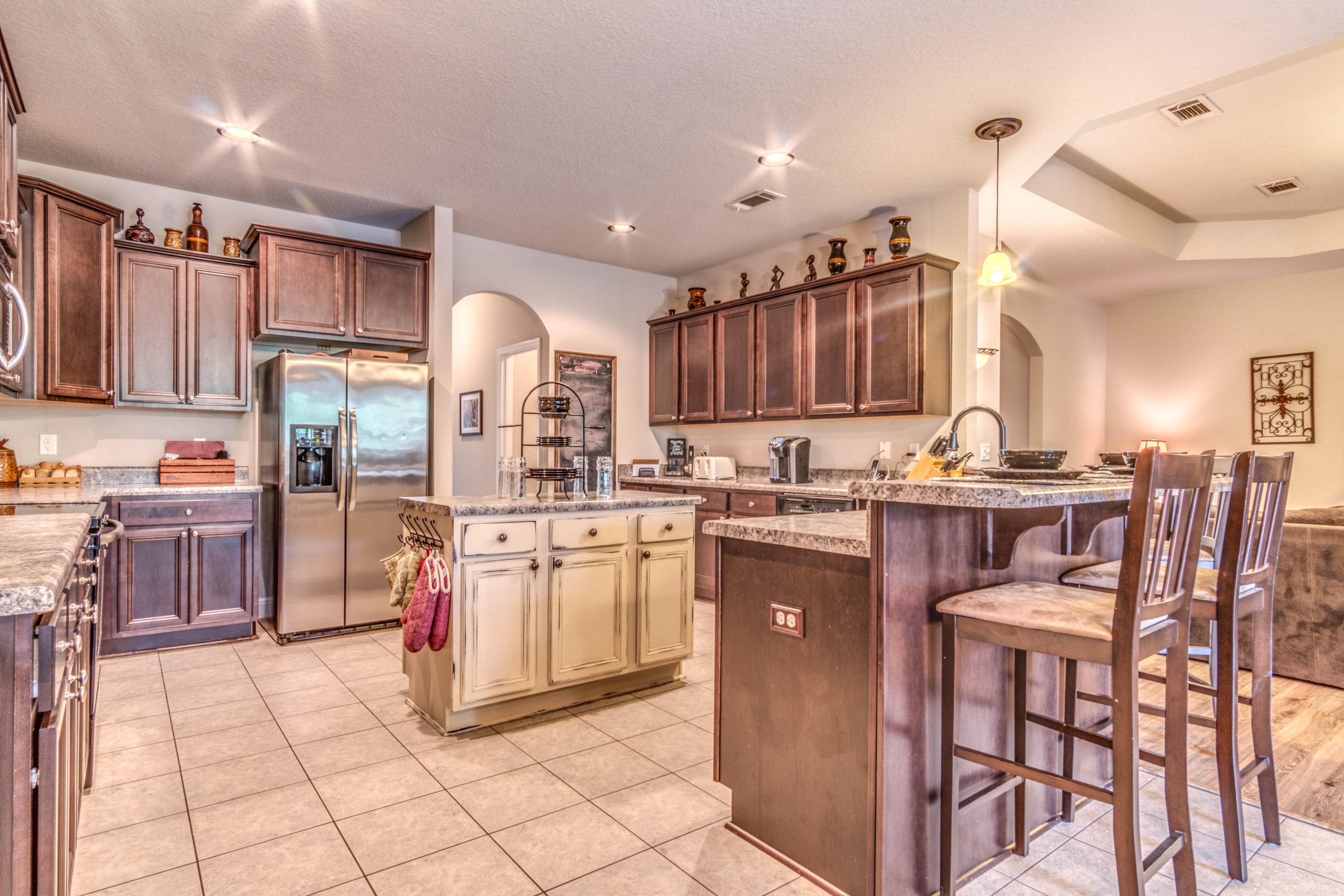 604 Red Fern Road Crestview, FL 32536 - Photo 5 of 36 a kitchen with stainless steel appliances granite countertop a stove top oven a sink dishwasher and cabinets