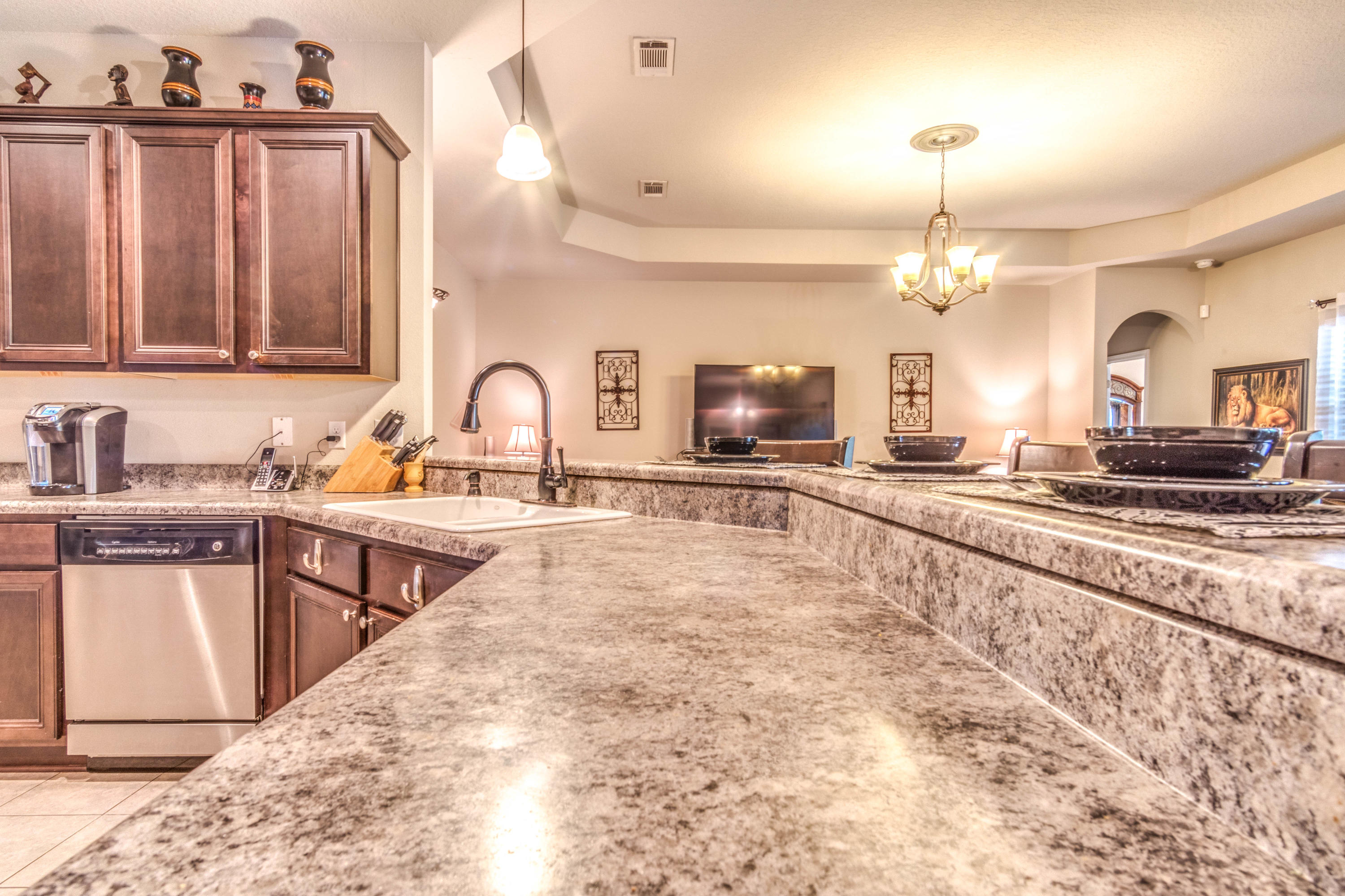 604 Red Fern Road Crestview, FL 32536 - Photo 8 of 36 a large kitchen with granite countertop a sink and cabinets