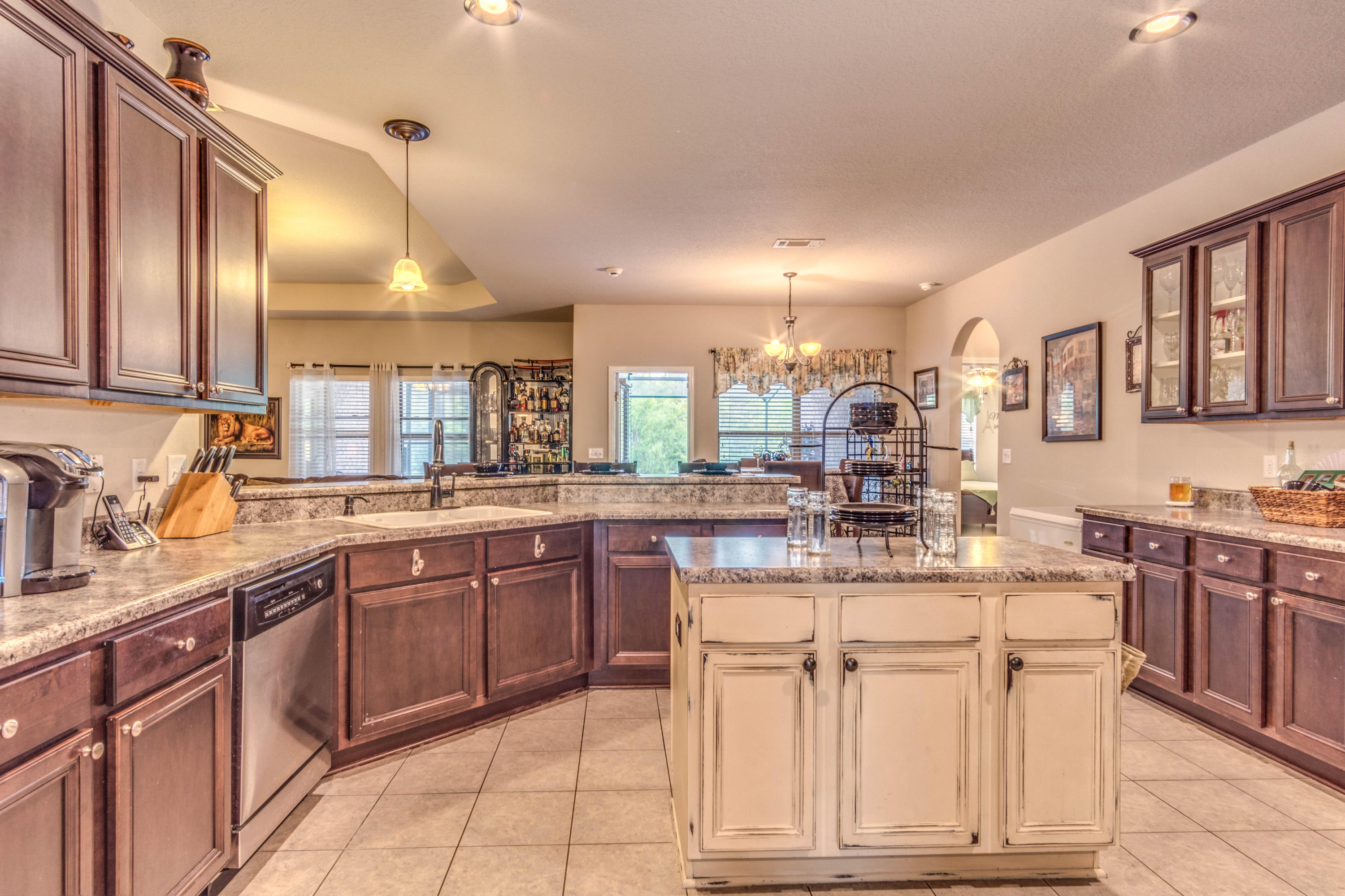 604 Red Fern Road Crestview, FL 32536 - Photo 9 of 36 a kitchen with cabinets and chairs