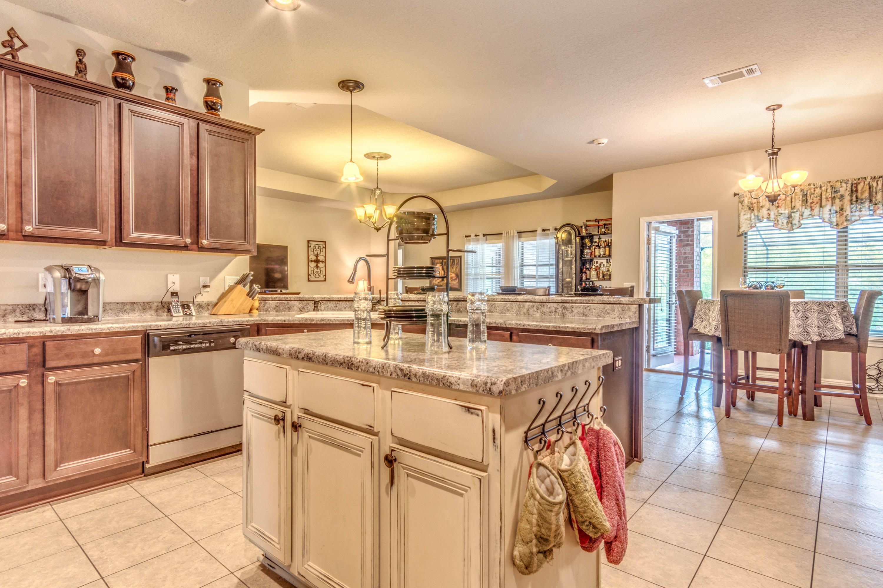 604 Red Fern Road Crestview, FL 32536 - Photo 10 of 36 a kitchen with stainless steel appliances granite countertop a sink and cabinets