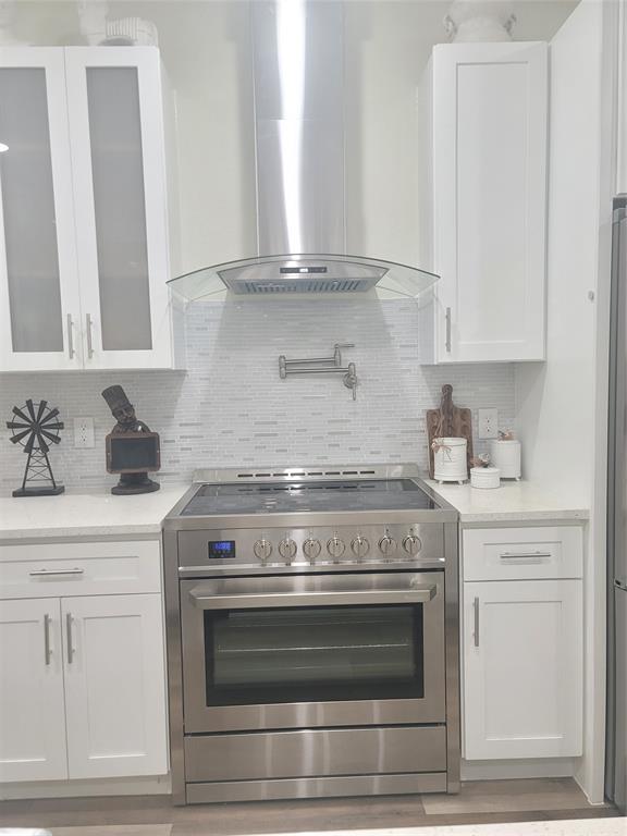 4825 Wichita Street Granbury, TX 76048 - Photo 11 of 30 a stove top oven sitting inside of a kitchen