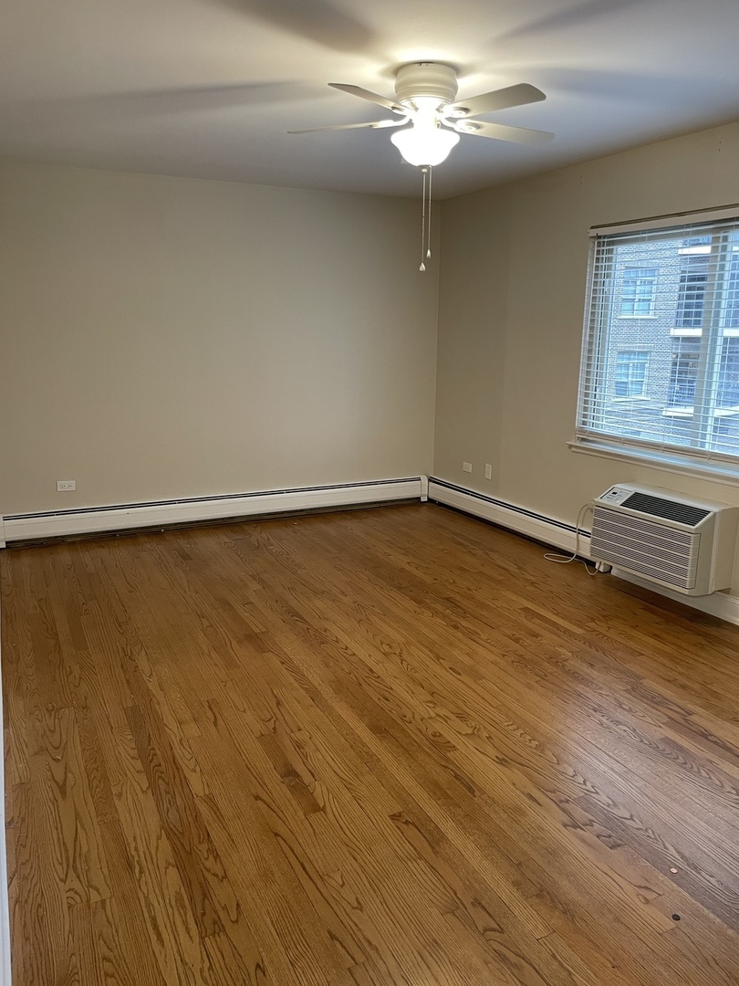 1 North Chestnut Avenue, Unit 2D Arlington Heights, IL 60005 - Photo 11 of 14 wooden floor in an empty room