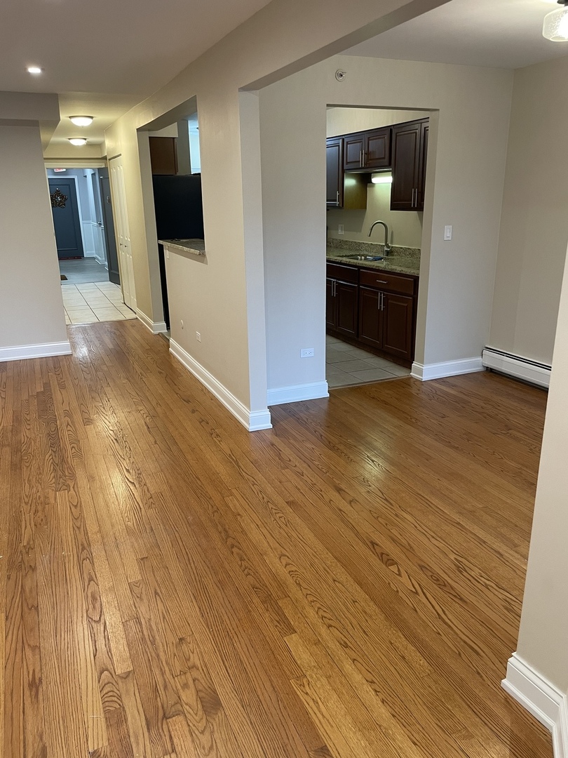 1 North Chestnut Avenue, Unit 2D Arlington Heights, IL 60005 - Photo 8 of 14 a view of a livingroom with wooden floor