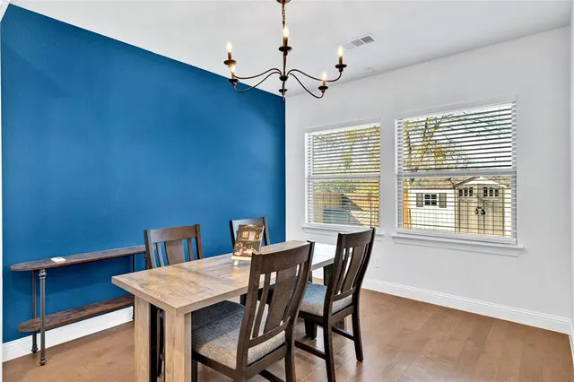 a view of a dining room with furniture and window