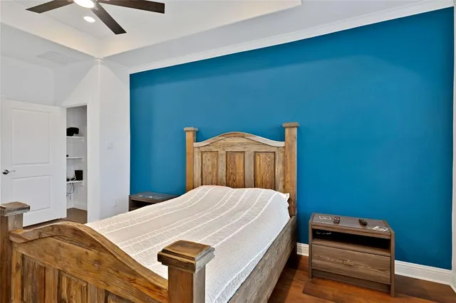 a bedroom with a bed and a desk