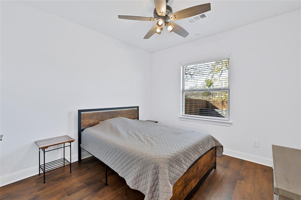 137 Gardenia Drive Azle, TX 76020 - Photo 19 of 38 Bedroom featuring dark wood finished floors and a ceiling fan