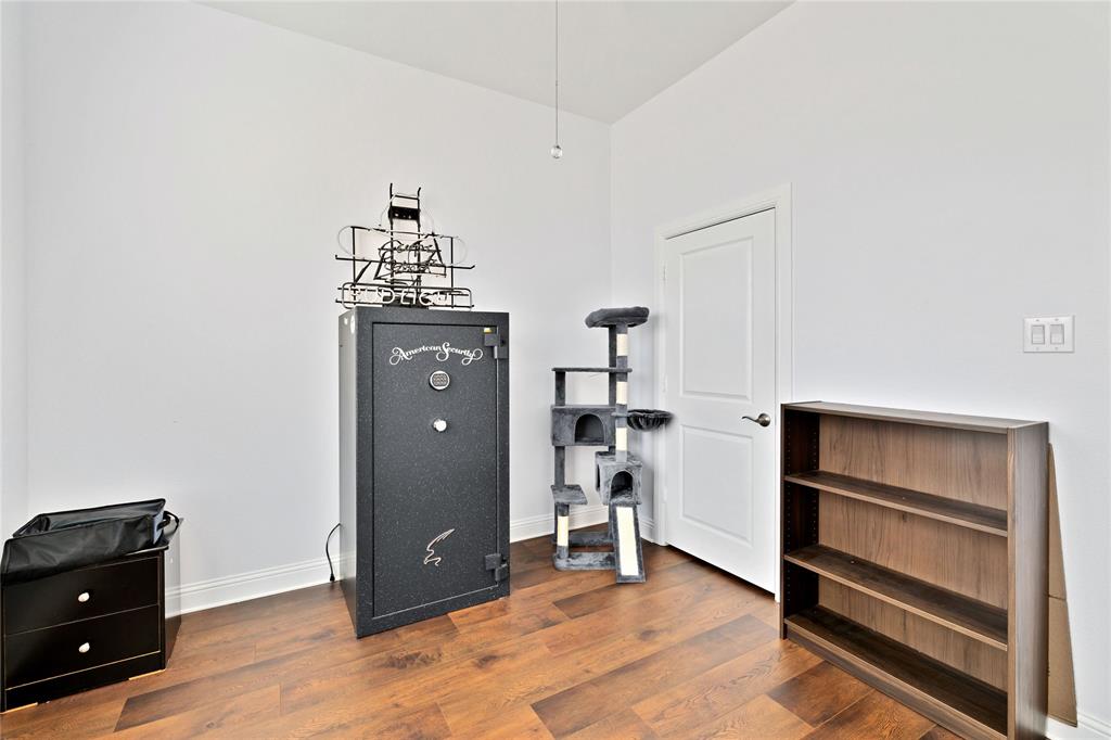 137 Gardenia Drive Azle, TX 76020 - Photo 21 of 38 Bedroom with dark wood-type flooring and baseboards