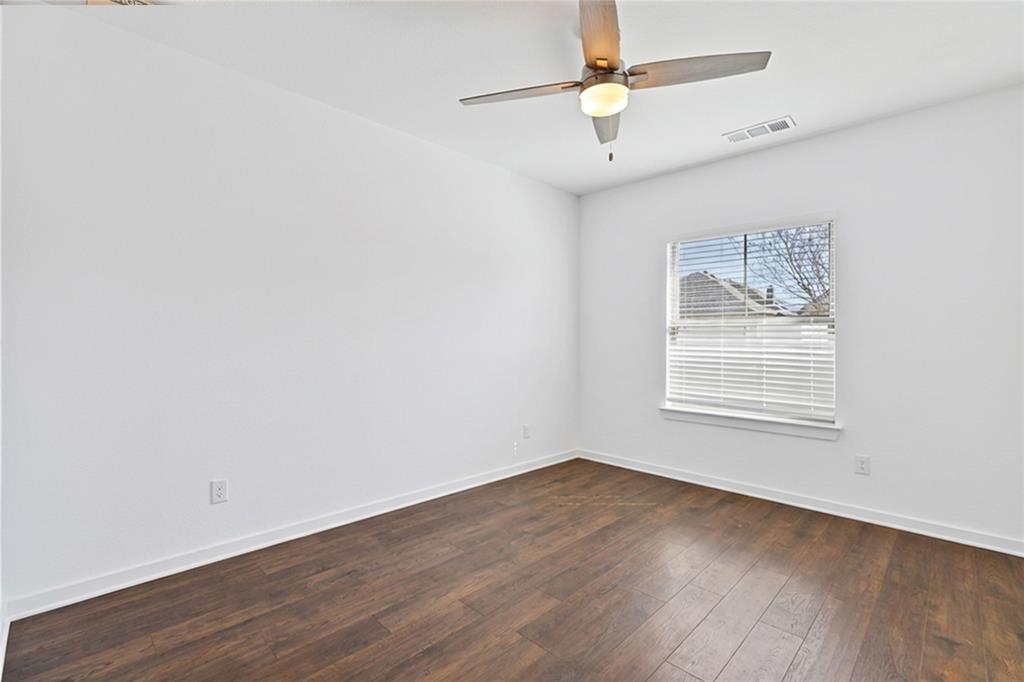 137 Gardenia Drive Azle, TX 76020 - Photo 24 of 38 Full bathroom with vanity, a shower stall, and light tile patterned floors