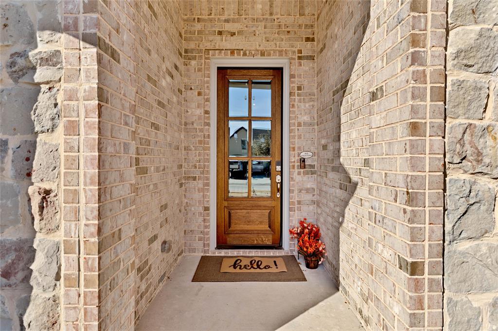 137 Gardenia Drive Azle, TX 76020 - Photo 3 of 38 Property entrance with brick siding and stone siding