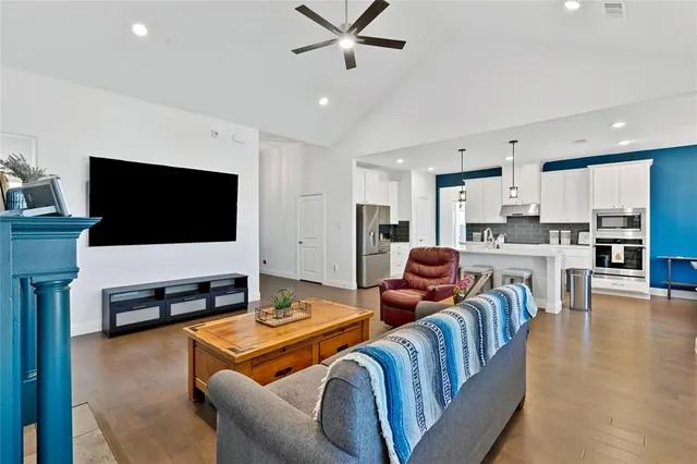a living room with furniture and a flat screen tv