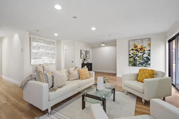 a living room with furniture and a large window