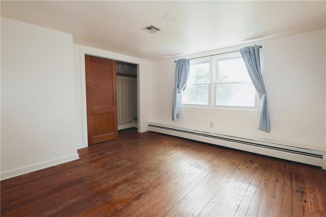 172 Harrison Street Emmaus, PA 18049 - Photo 12 of 30 Well-lit sleeping quarters with rich hardwood flooring and a functional closet for ample storage.