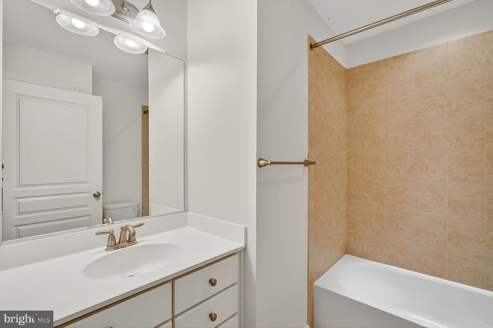 1755 Chiswick Court Silver Spring, MD 20904 - Photo 20 of 34 a bathroom with a sink and a mirror