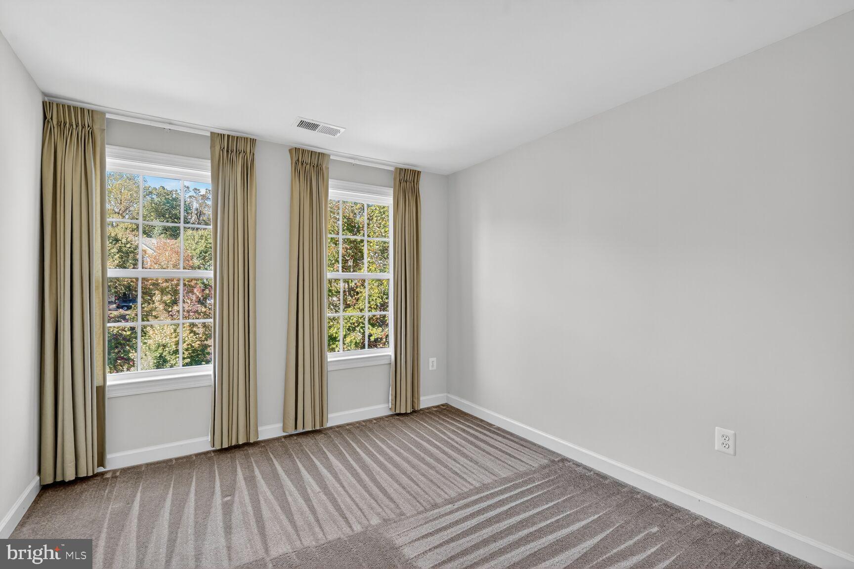 1755 Chiswick Court Silver Spring, MD 20904 - Photo 22 of 34 wooden floor in an empty room with a window