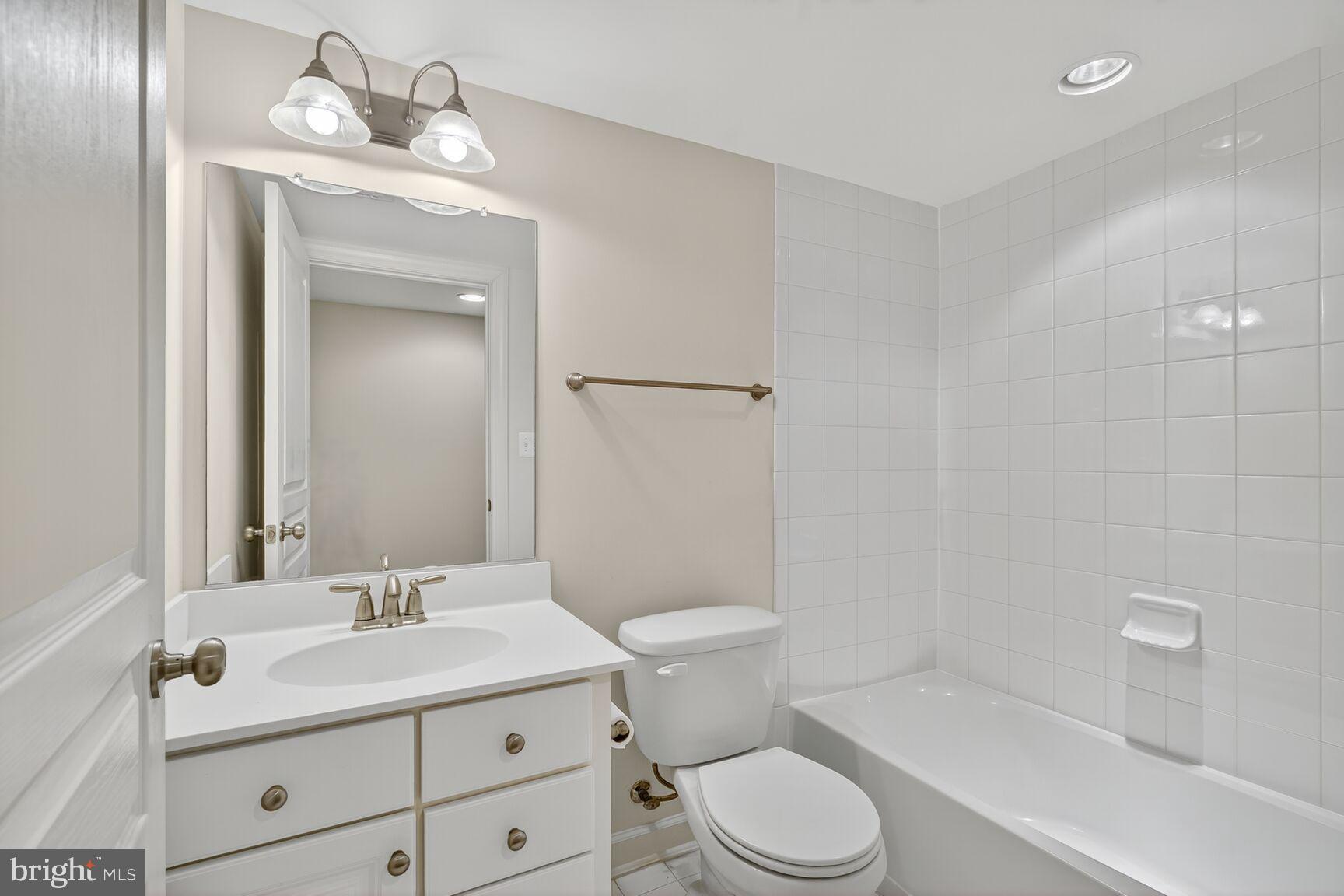 1755 Chiswick Court Silver Spring, MD 20904 - Photo 26 of 34 a bathroom with a sink a toilet and shower