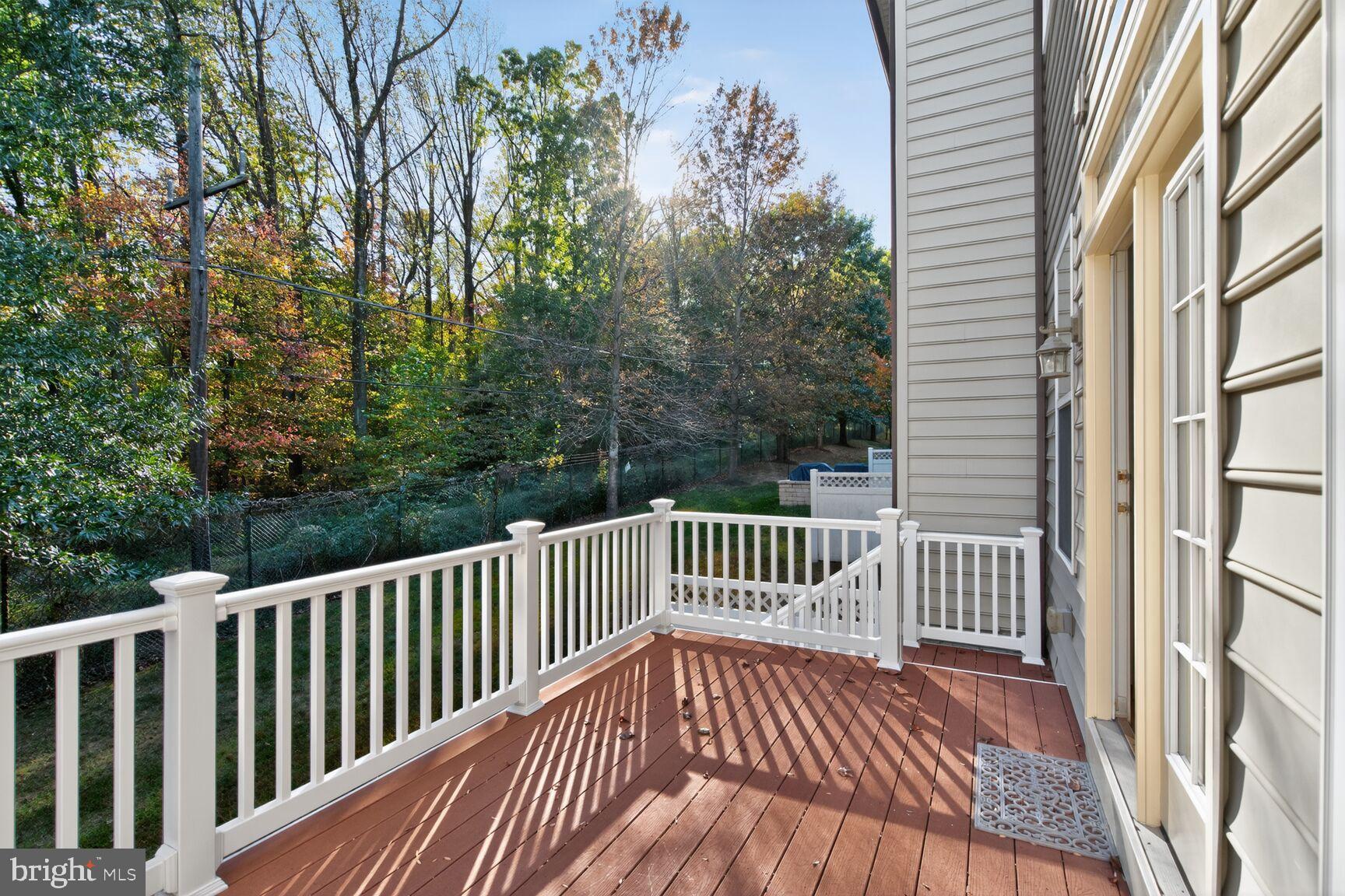 1755 Chiswick Court Silver Spring, MD 20904 - Photo 28 of 34 a view of balcony with wooden floor and fence