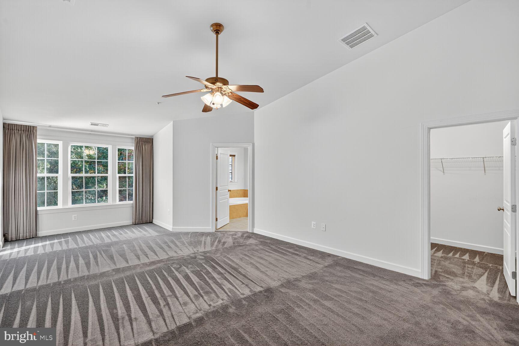 1755 Chiswick Court Silver Spring, MD 20904 - Photo 10 of 34 a view of empty room with wooden floor and fan