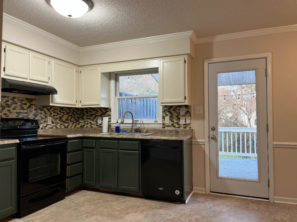 a kitchen with stainless steel appliances granite countertop a stove and a sink