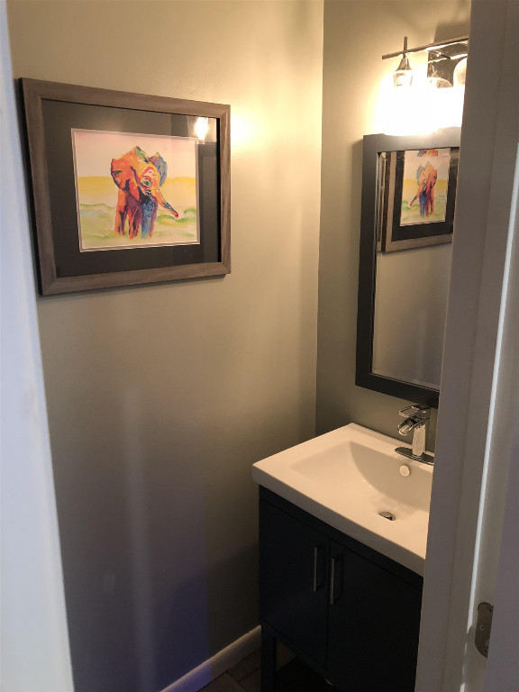 Undisclosed Address Raleigh, NC 27606 - Photo 3 of 4 a bathroom with a sink and a mirror