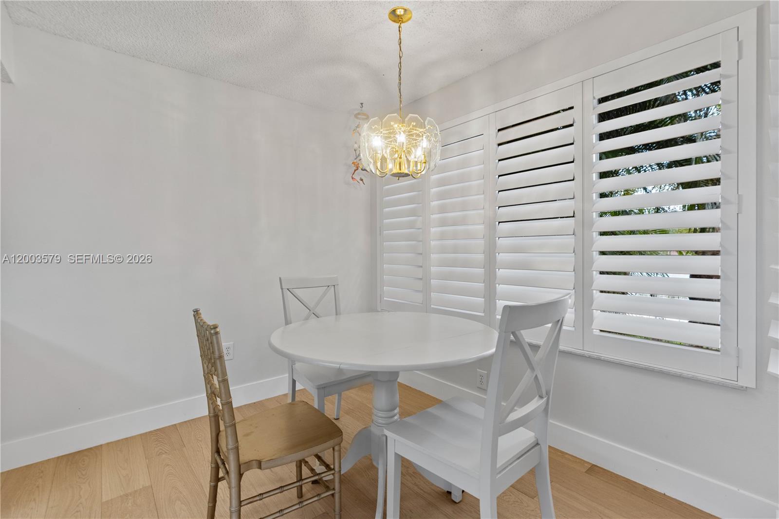 237 Northwest 100th Avenue Plantation, FL 33324 - Photo 15 of 86 a view of a dining room with furniture and chandelier