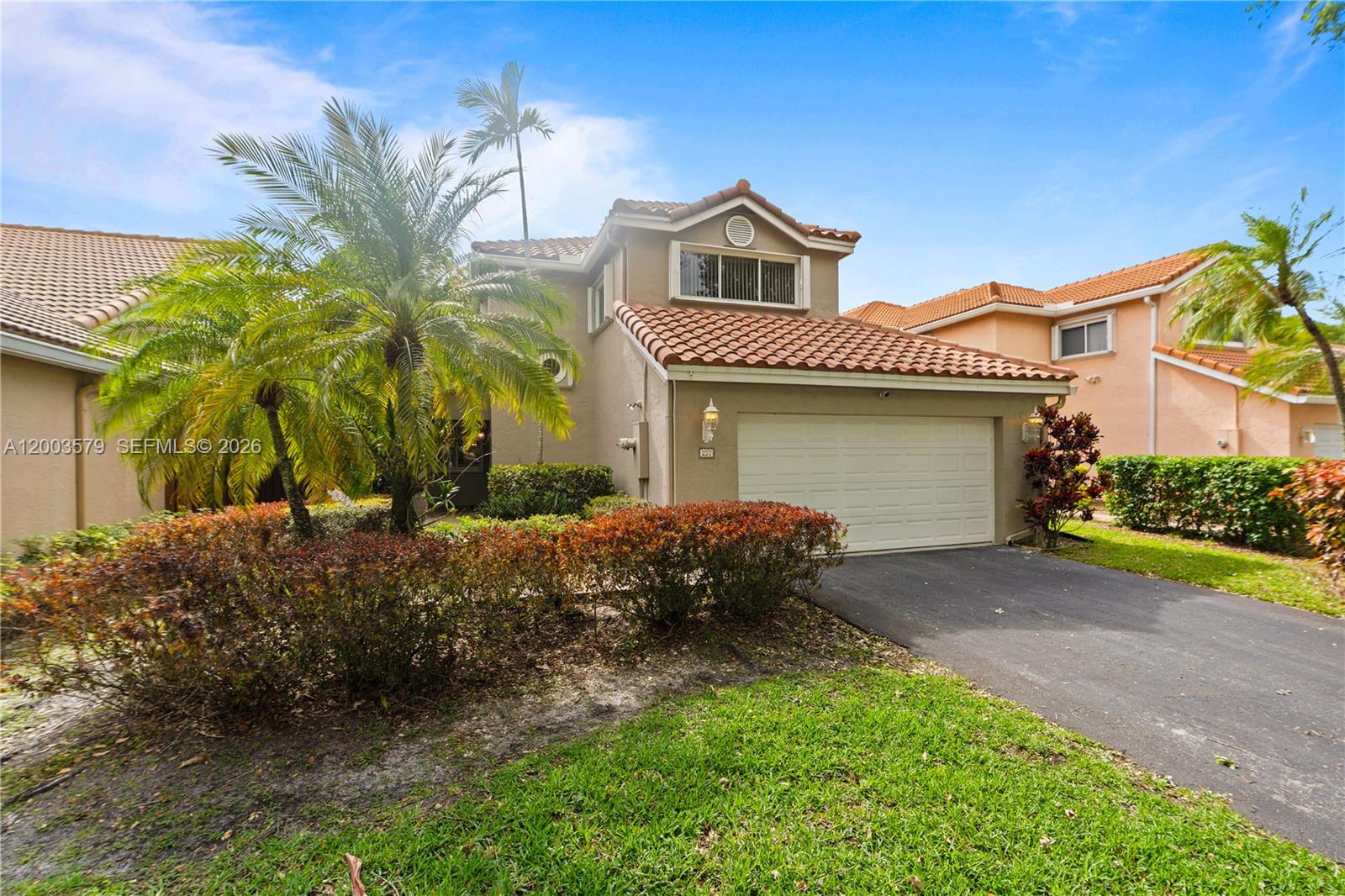 237 Northwest 100th Avenue Plantation, FL 33324 - Photo 2 of 86 a front view of a house with garden