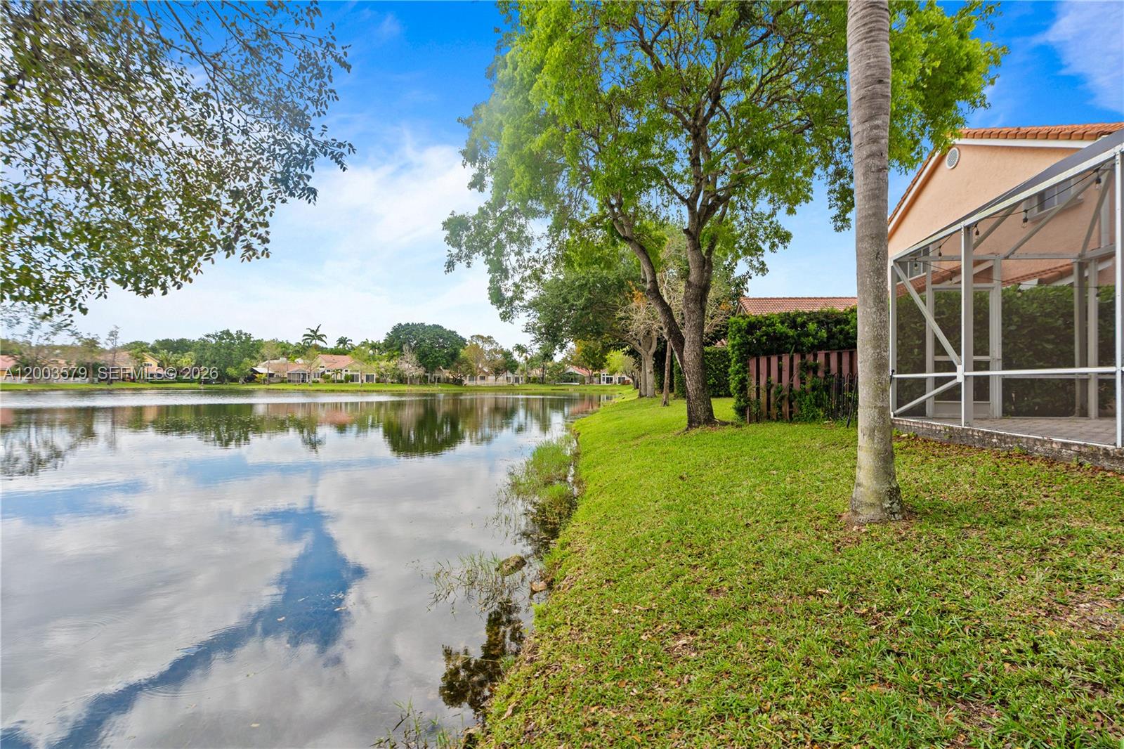 237 Northwest 100th Avenue Plantation, FL 33324 - Photo 33 of 86 a view of a lake with houses in the back