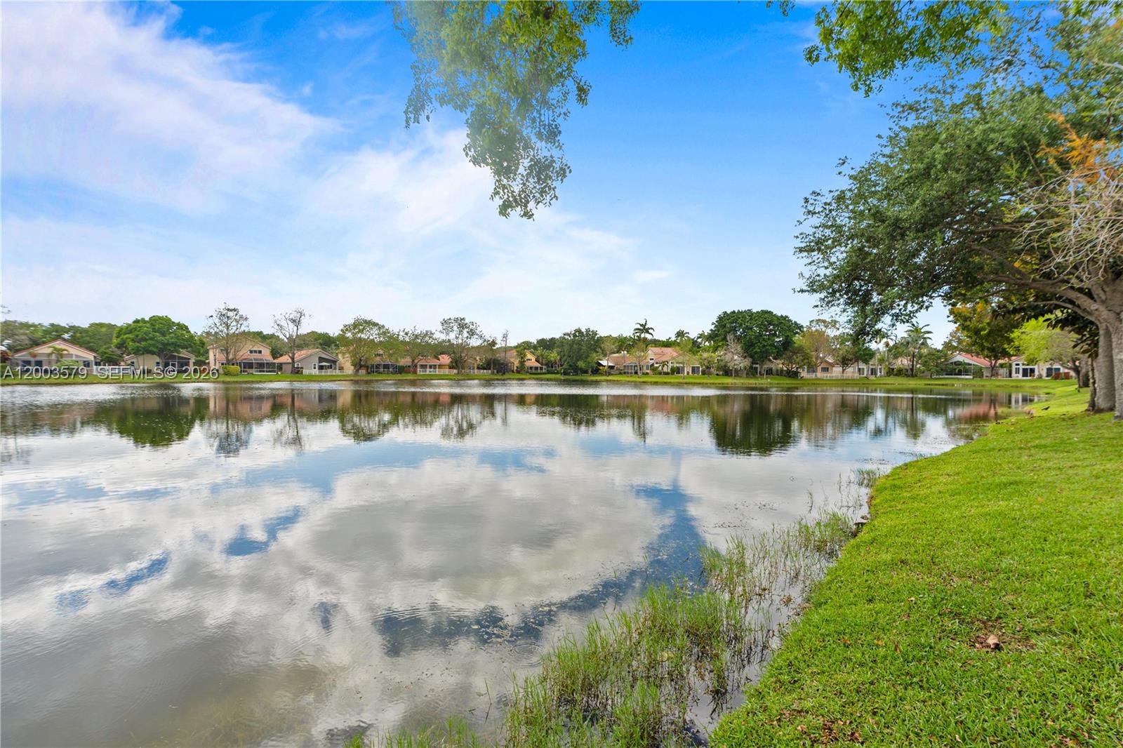 237 Northwest 100th Avenue Plantation, FL 33324 - Photo 35 of 86 a view of a lake with houses in the back