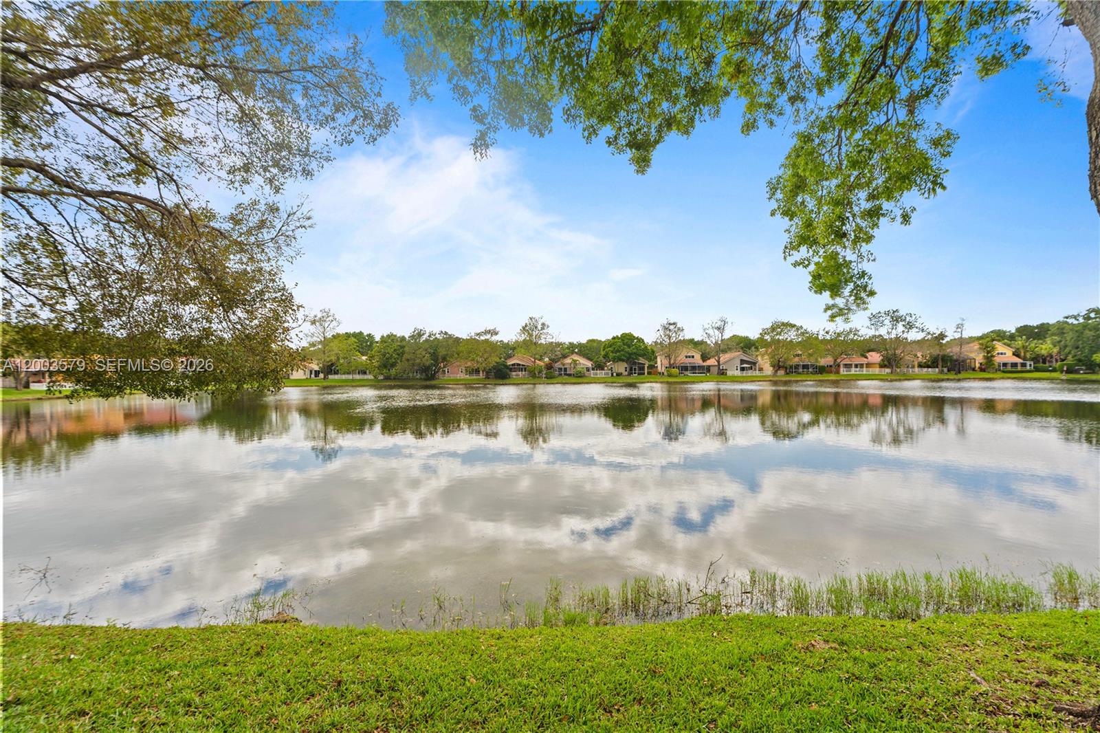 237 Northwest 100th Avenue Plantation, FL 33324 - Photo 37 of 86 a view of a lake with houses in the background