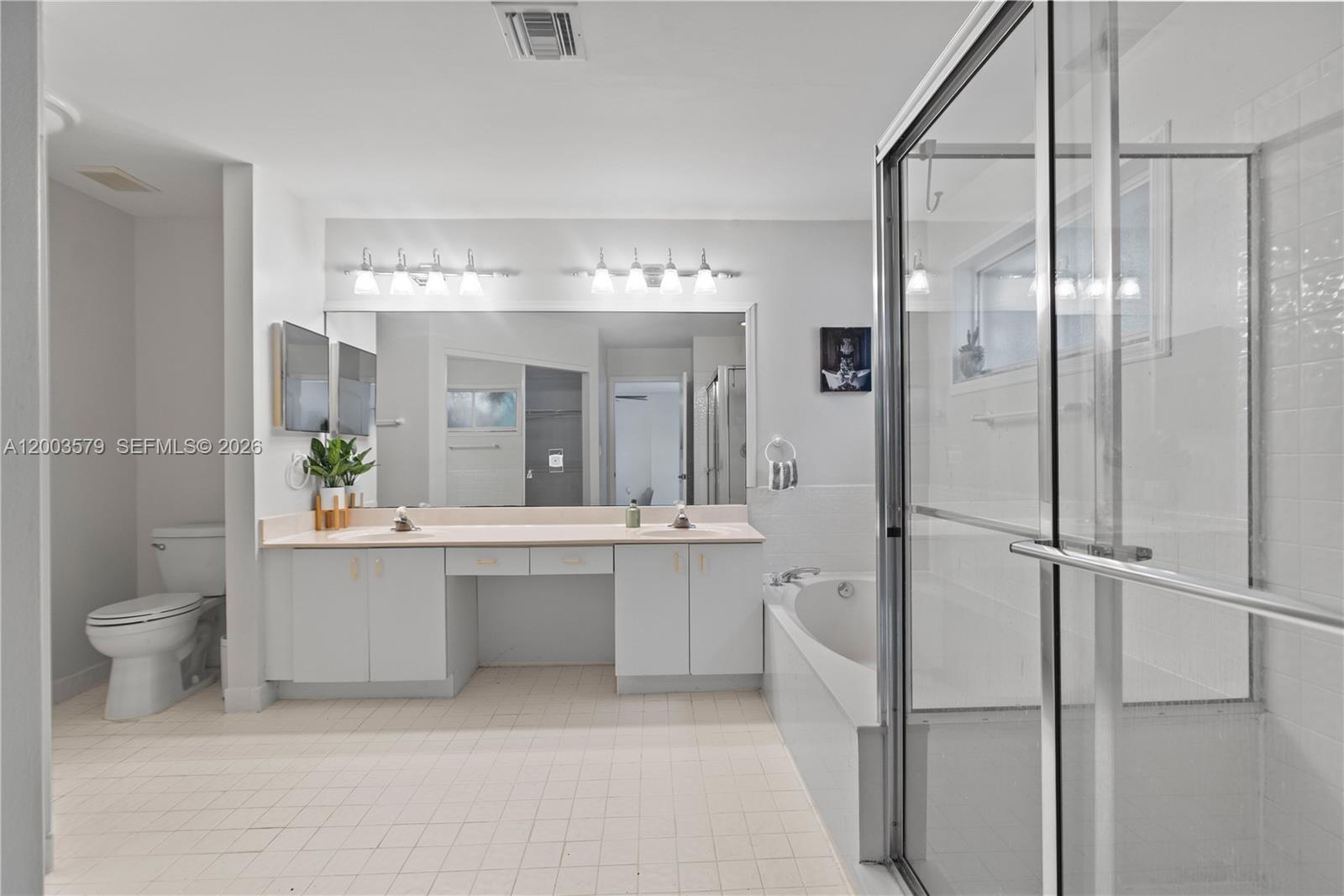 237 Northwest 100th Avenue Plantation, FL 33324 - Photo 44 of 86 a large white bathroom with a granite countertop sink mirror and toilet