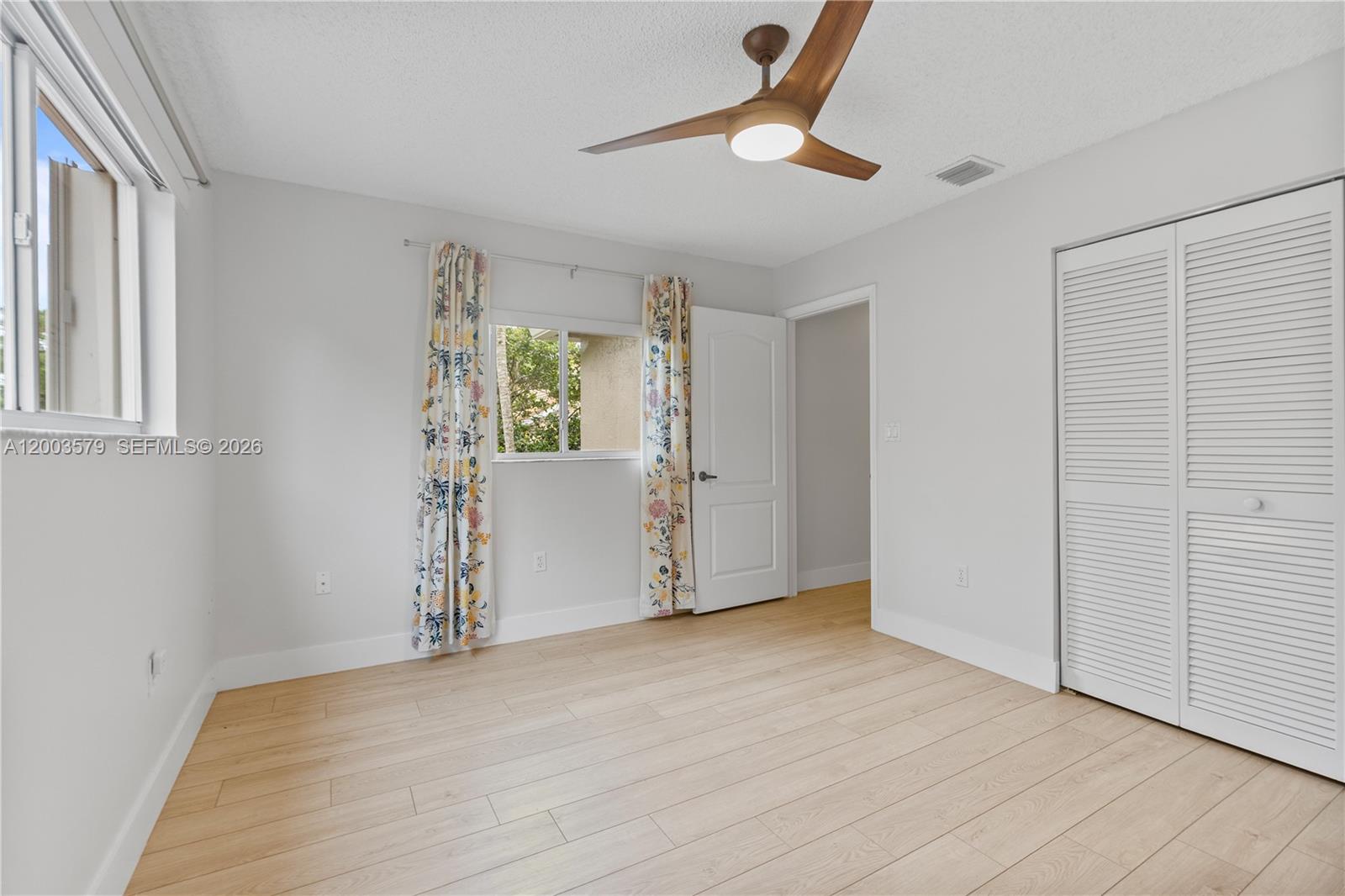 237 Northwest 100th Avenue Plantation, FL 33324 - Photo 45 of 86 an empty room with wooden floor cabinet and windows