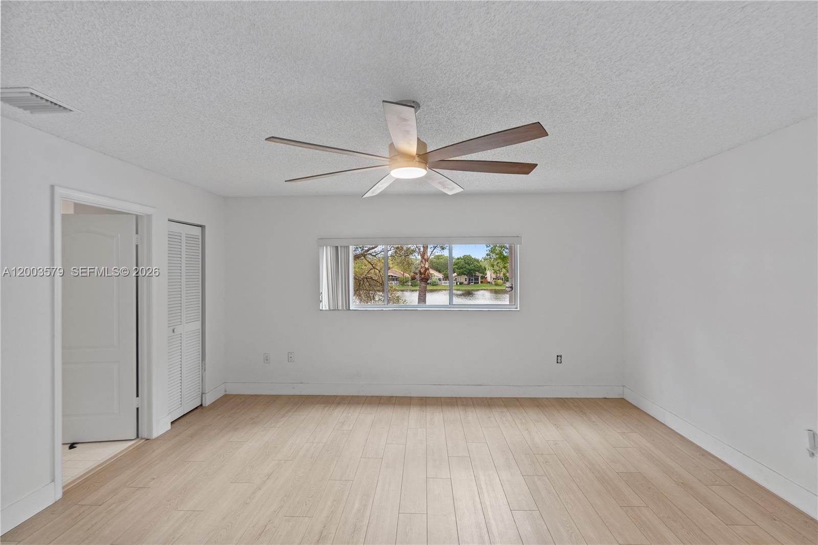 237 Northwest 100th Avenue Plantation, FL 33324 - Photo 59 of 86 an empty room with window and ceiling fan