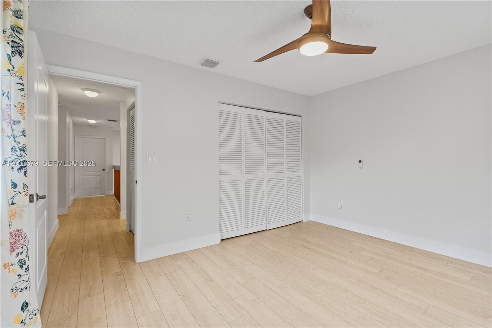 237 Northwest 100th Avenue Plantation, FL 33324 - Photo 63 of 86 wooden floor in an empty room with a bathroom