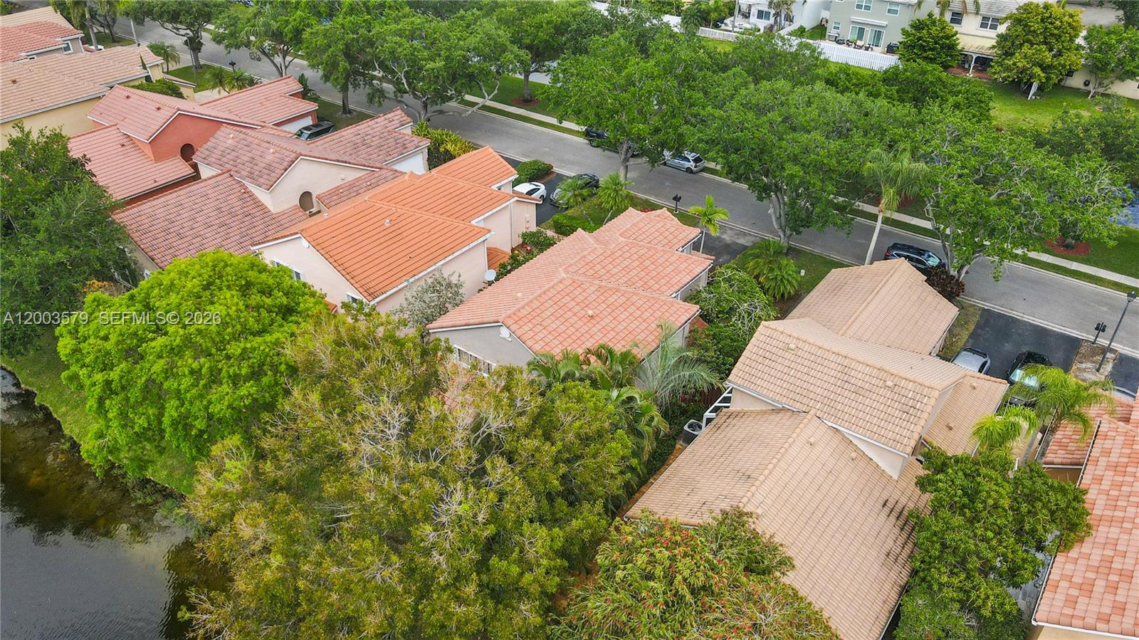 237 Northwest 100th Avenue Plantation, FL 33324 - Photo 73 of 86 an aerial view of a house with a yard and trees all around
