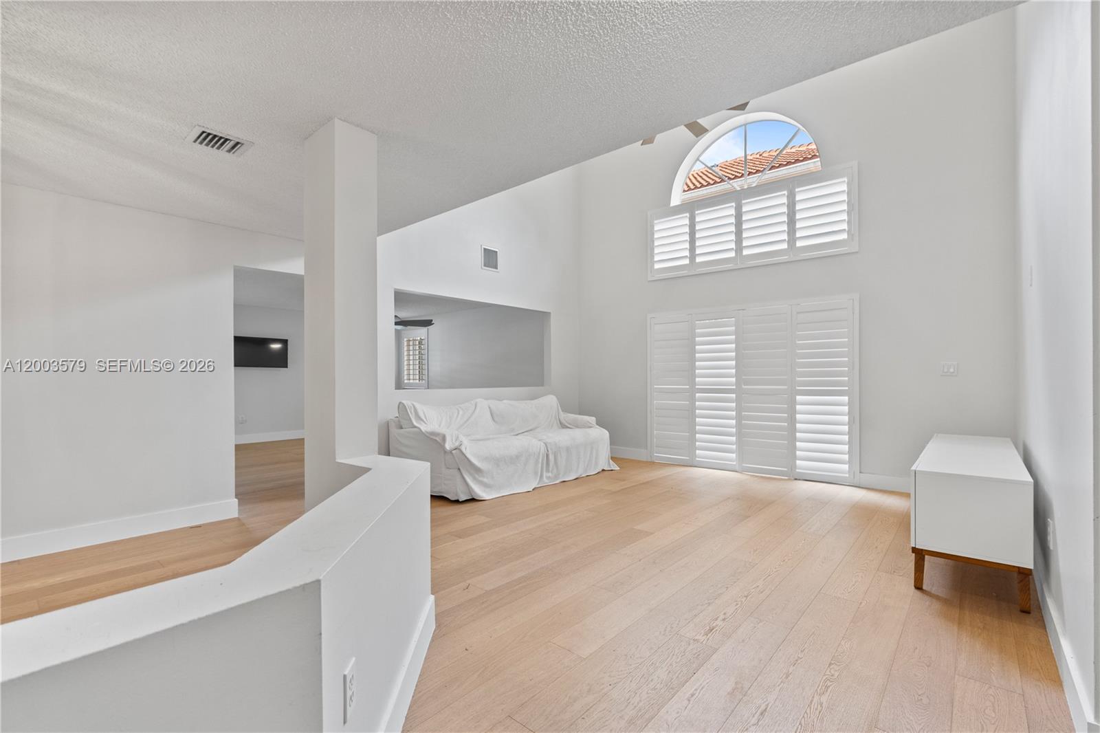 237 Northwest 100th Avenue Plantation, FL 33324 - Photo 8 of 86 a bedroom with a large bed and a window