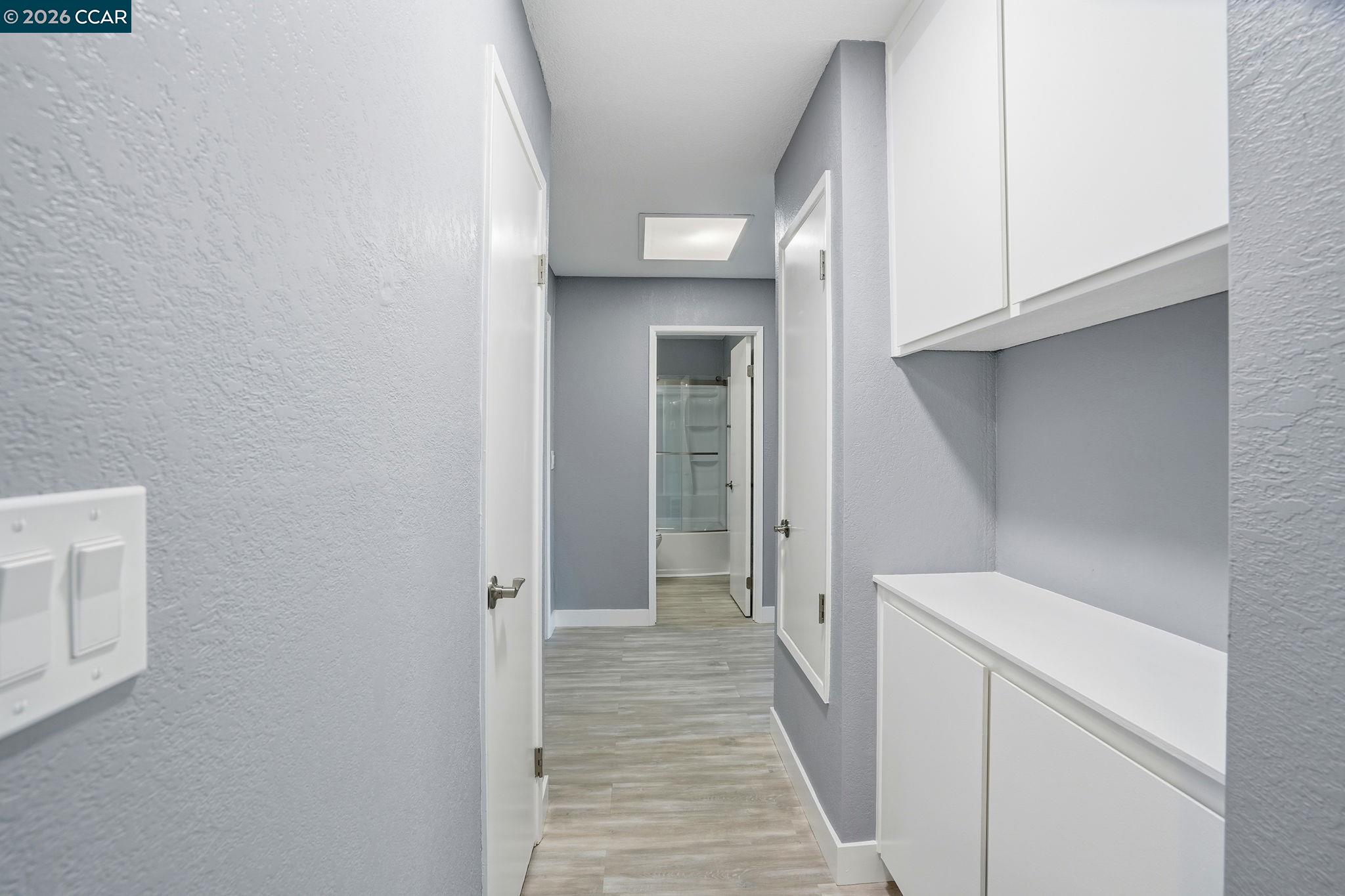 834 Coral Ridge Circle Rodeo, CA 94572 - Photo 13 of 32 a view of a hallway with washer and dryer