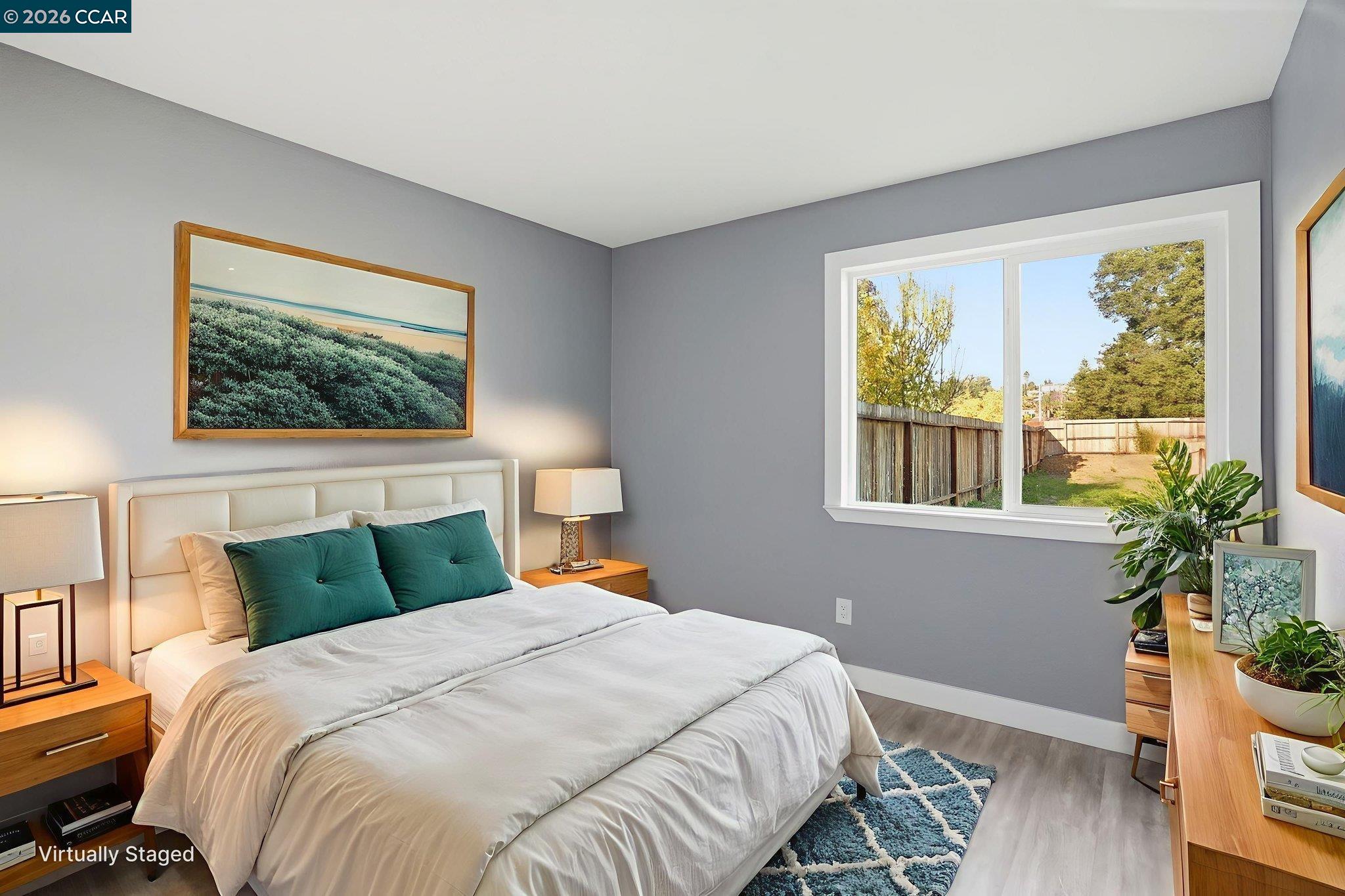 834 Coral Ridge Circle Rodeo, CA 94572 - Photo 19 of 32 a bedroom with a bed and a potted plant