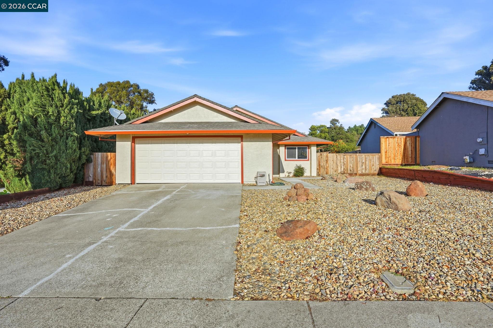834 Coral Ridge Circle Rodeo, CA 94572 - Photo 2 of 32 a front view of a house with a yard